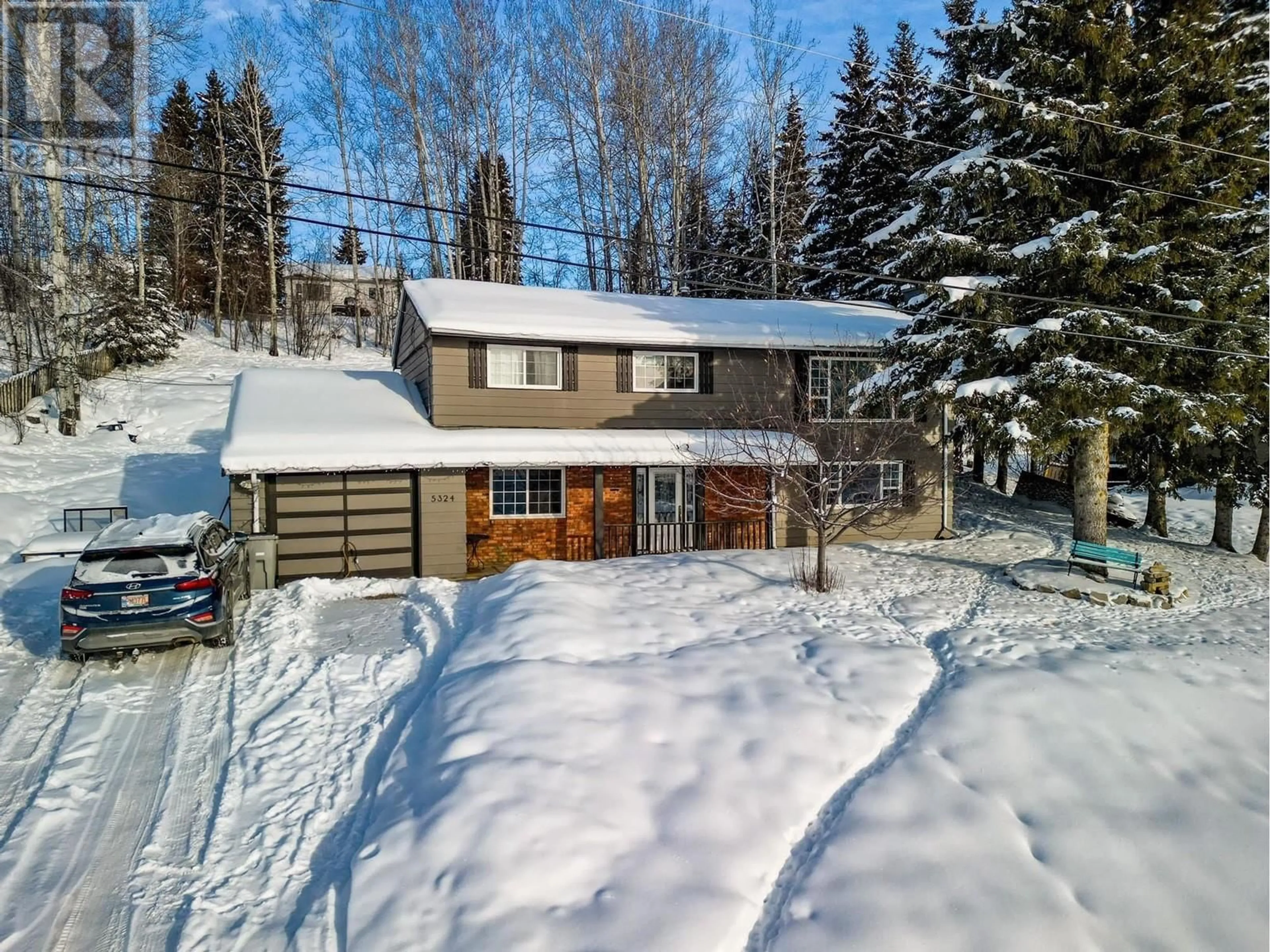 A pic from outside/outdoor area/front of a property/back of a property/a pic from drone, street for 5324 W 53 AVENUE, Fort Nelson British Columbia V0C1R0