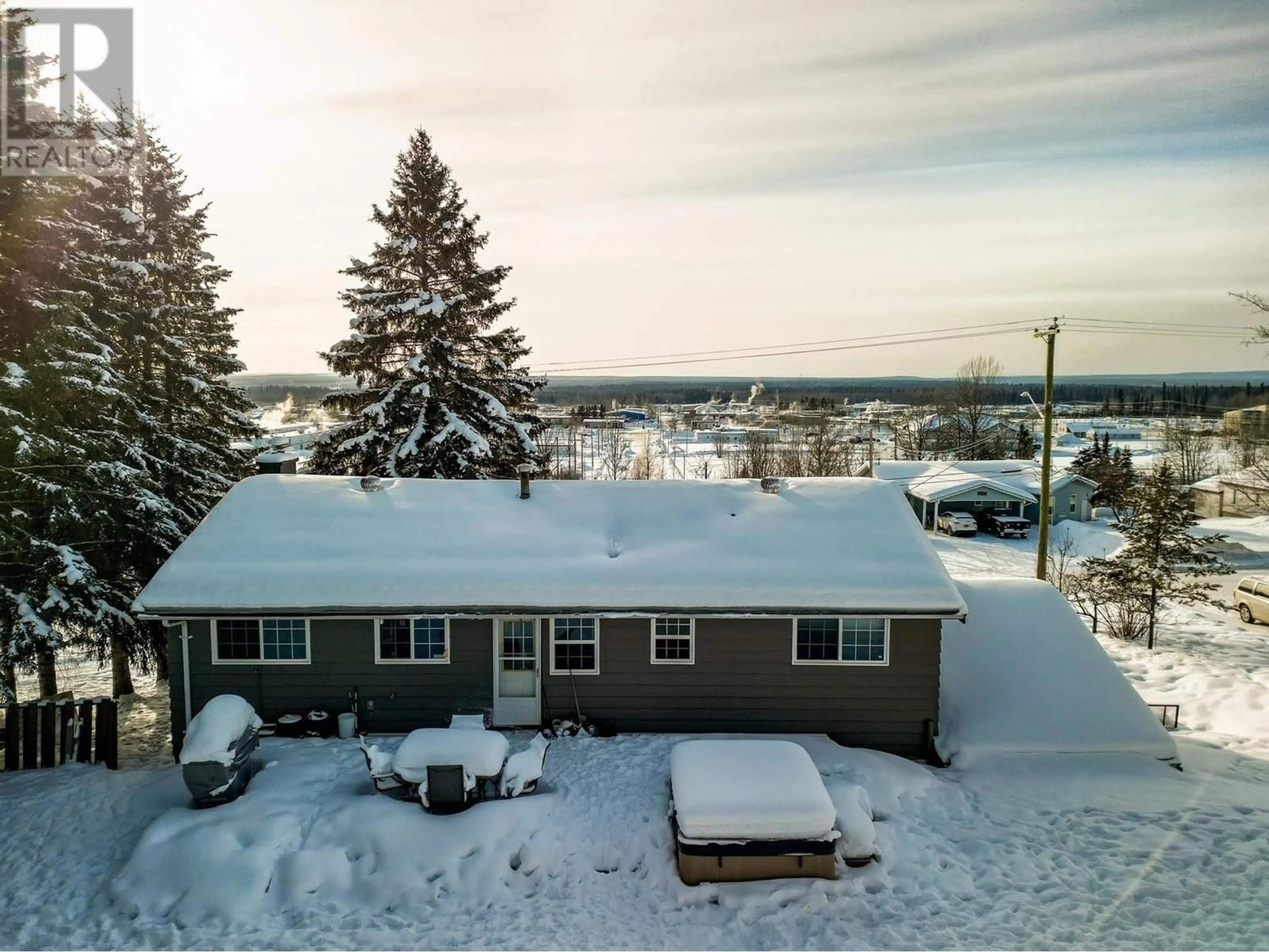 A pic from outside/outdoor area/front of a property/back of a property/a pic from drone, unknown for 5324 W 53 AVENUE, Fort Nelson British Columbia V0C1R0