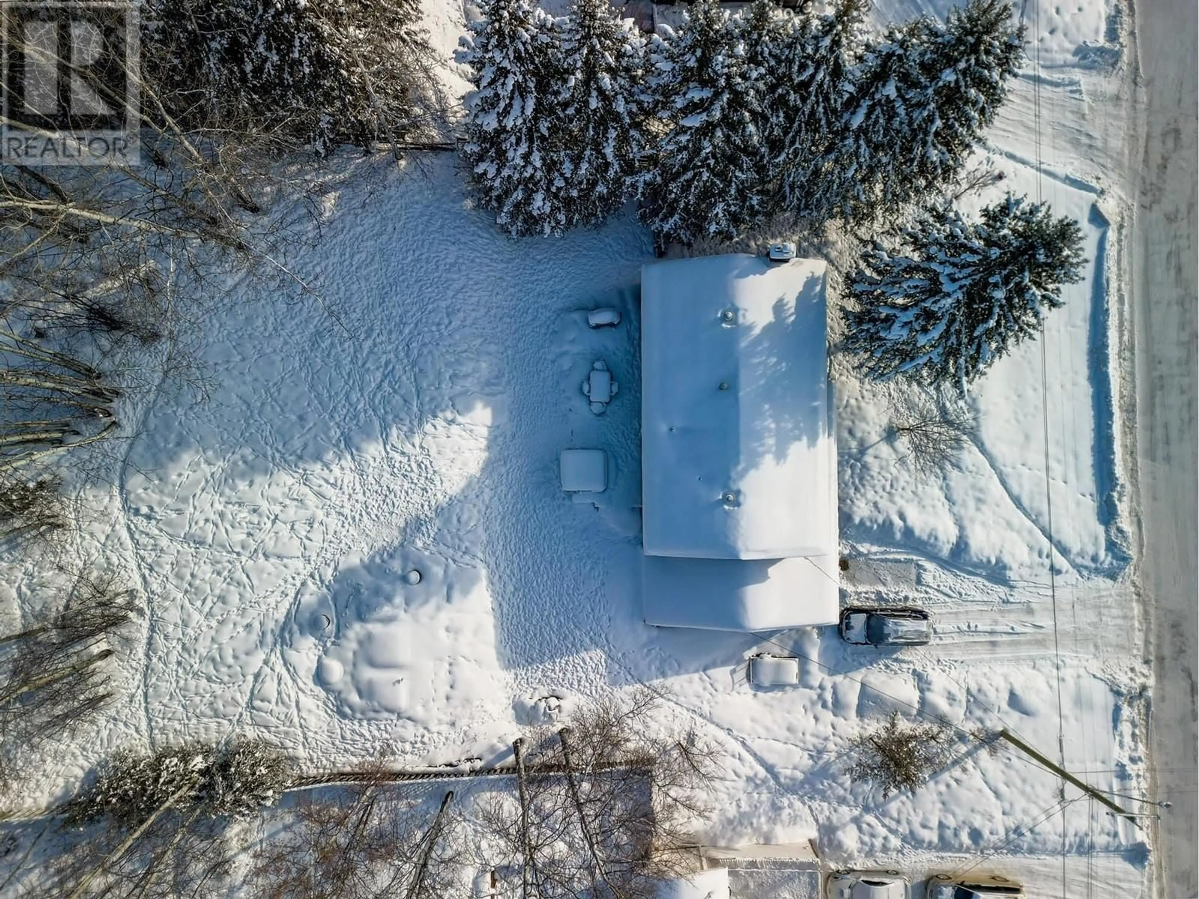 A pic from outside/outdoor area/front of a property/back of a property/a pic from drone, street for 5324 W 53 AVENUE, Fort Nelson British Columbia V0C1R0