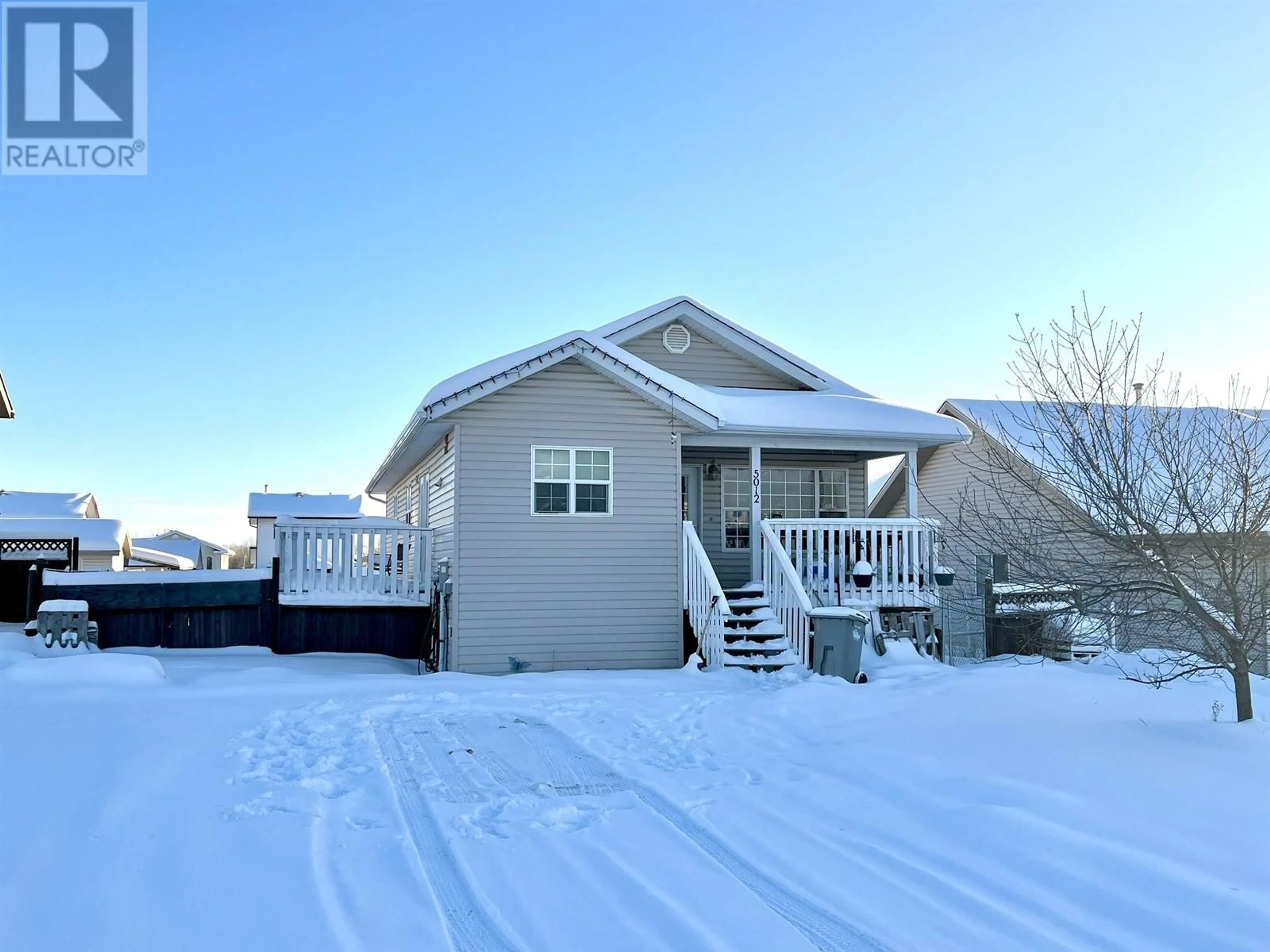 Home with vinyl exterior material, street for 5012 46 STREET, Fort Nelson British Columbia V0C1R0