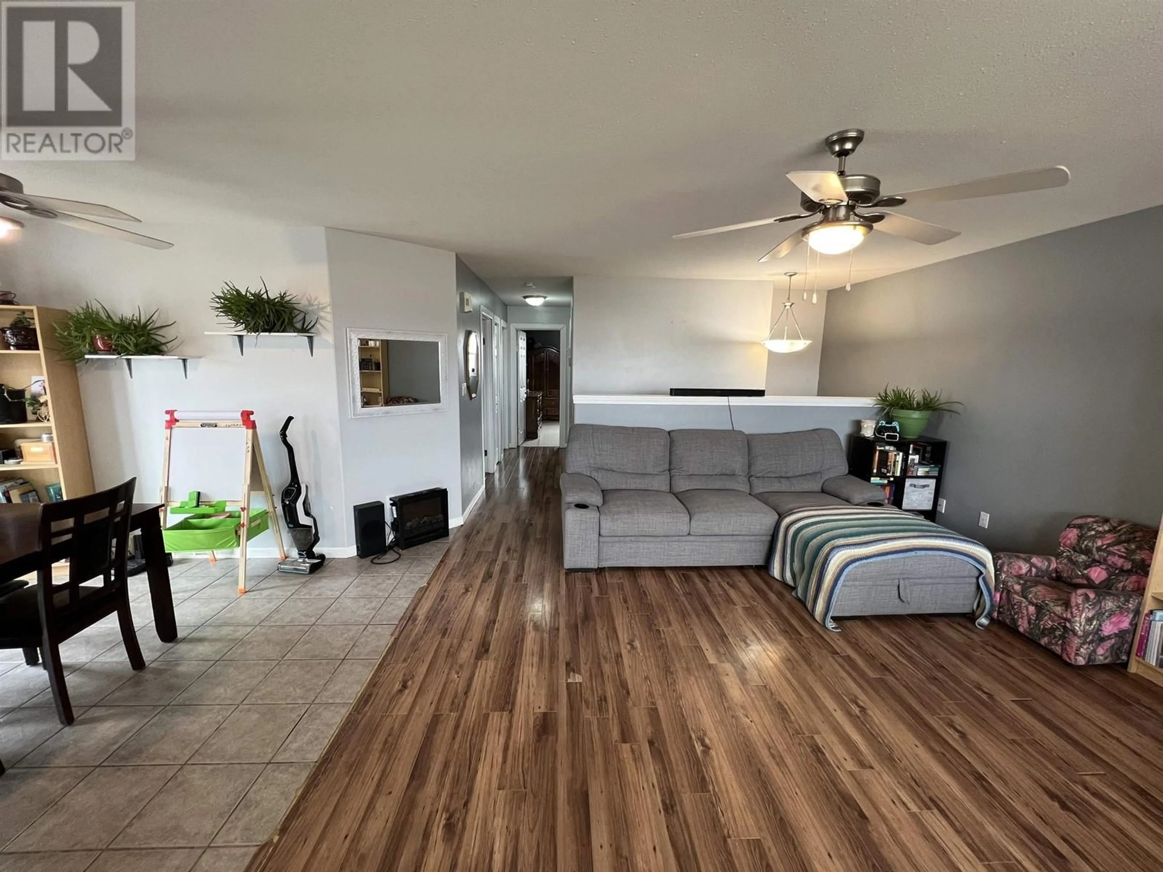 Living room with furniture, wood/laminate floor for 5012 46 STREET, Fort Nelson British Columbia V0C1R0