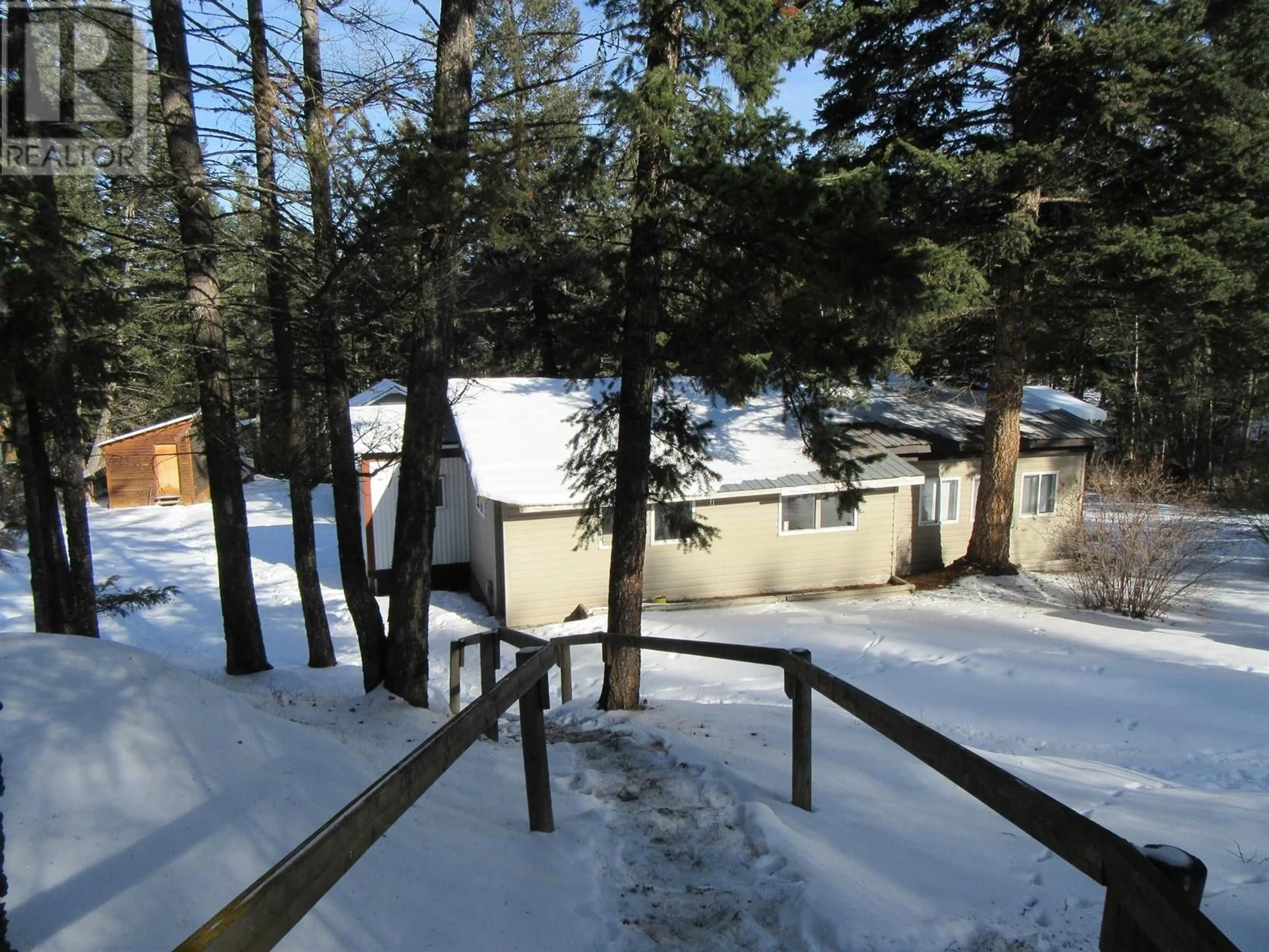 A pic from outside/outdoor area/front of a property/back of a property/a pic from drone, unknown for 5484 SAUNDERS CRESCENT, 103 Mile House British Columbia V0K2E1