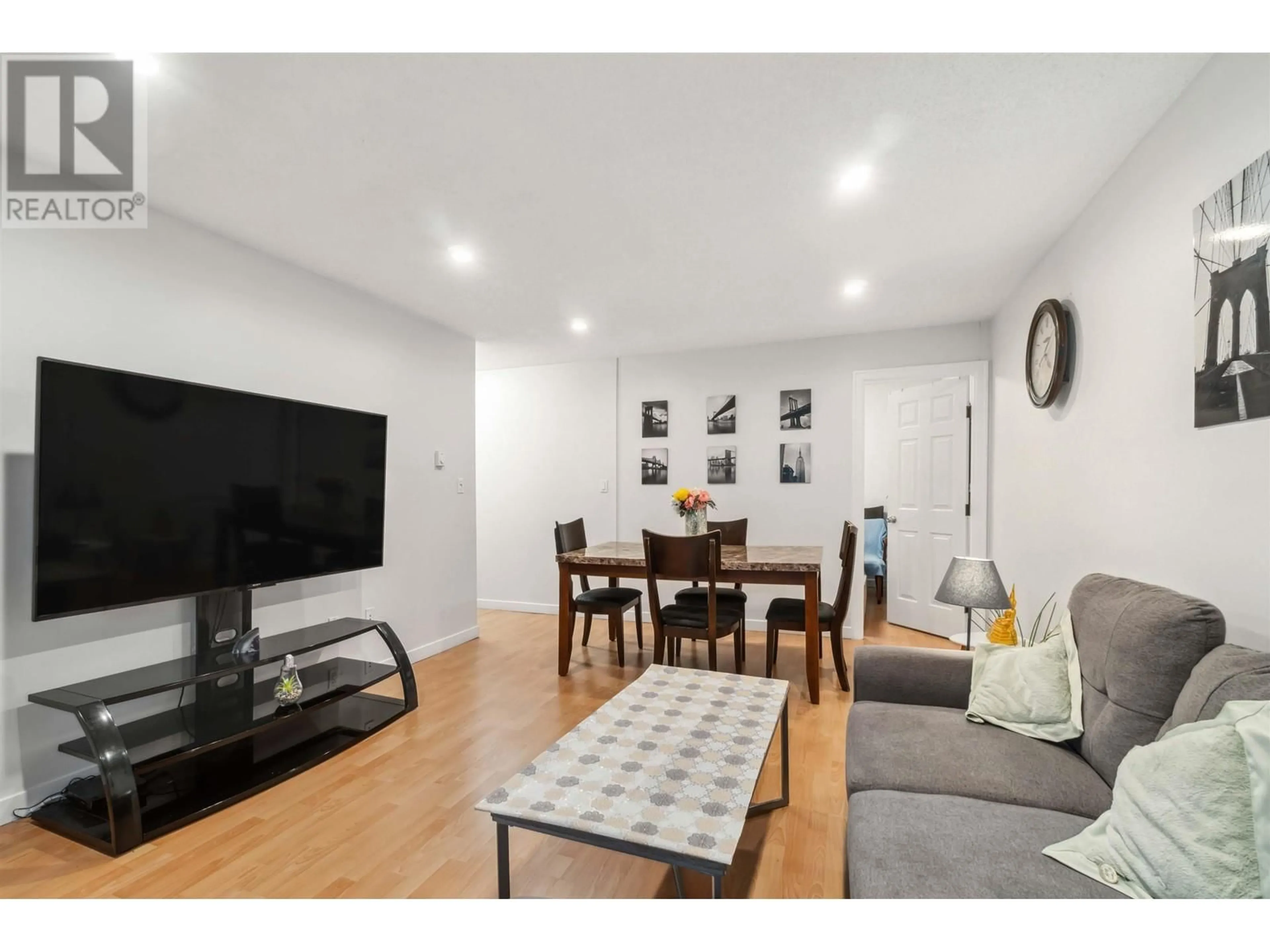 Living room with furniture, wood/laminate floor for 203 6105 KINGSWAY, Burnaby British Columbia V5J5C7