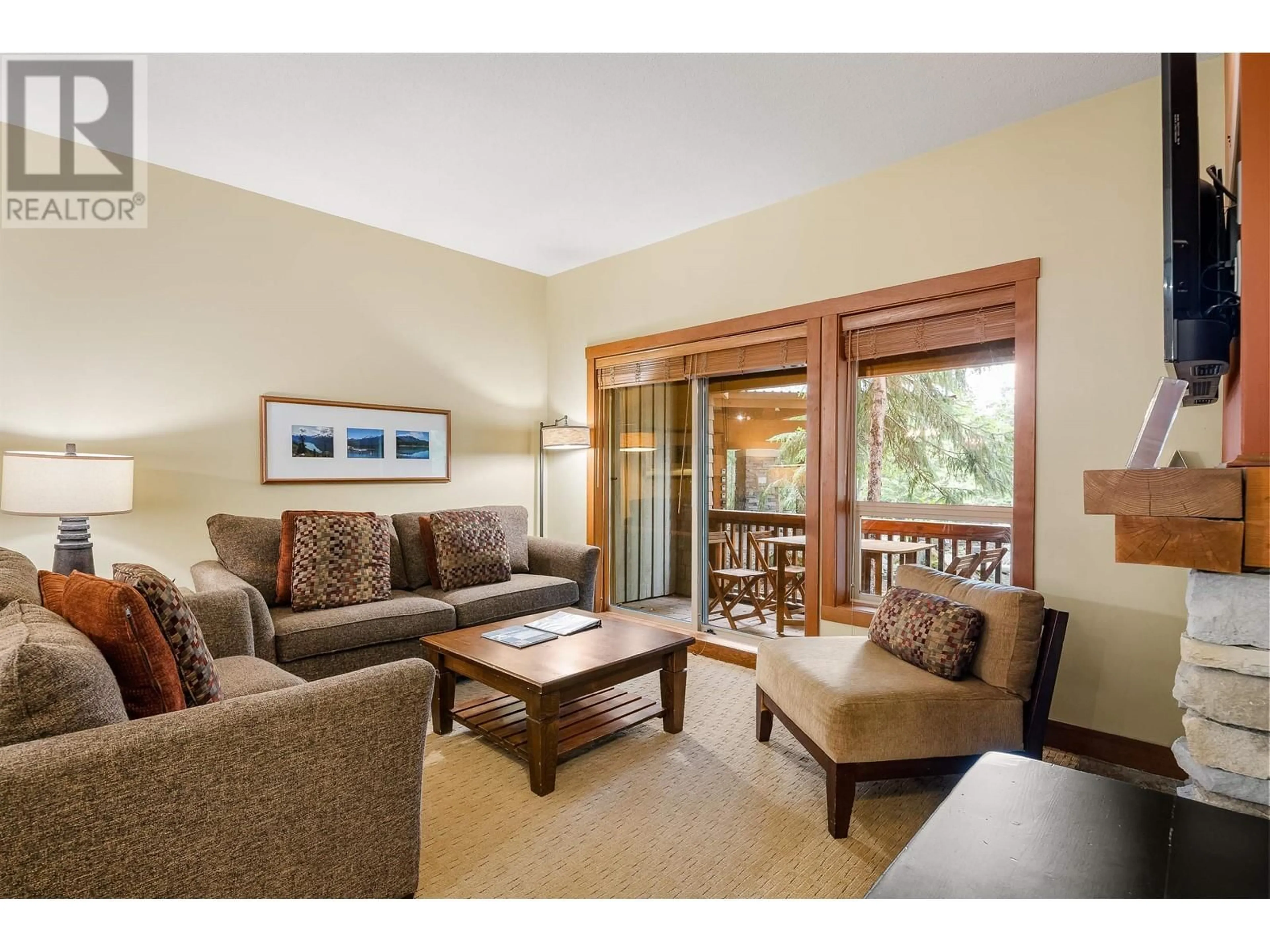 Living room with furniture, wood/laminate floor for 104(G4) 4653 BLACKCOMB WAY, Whistler British Columbia V8E0Y9