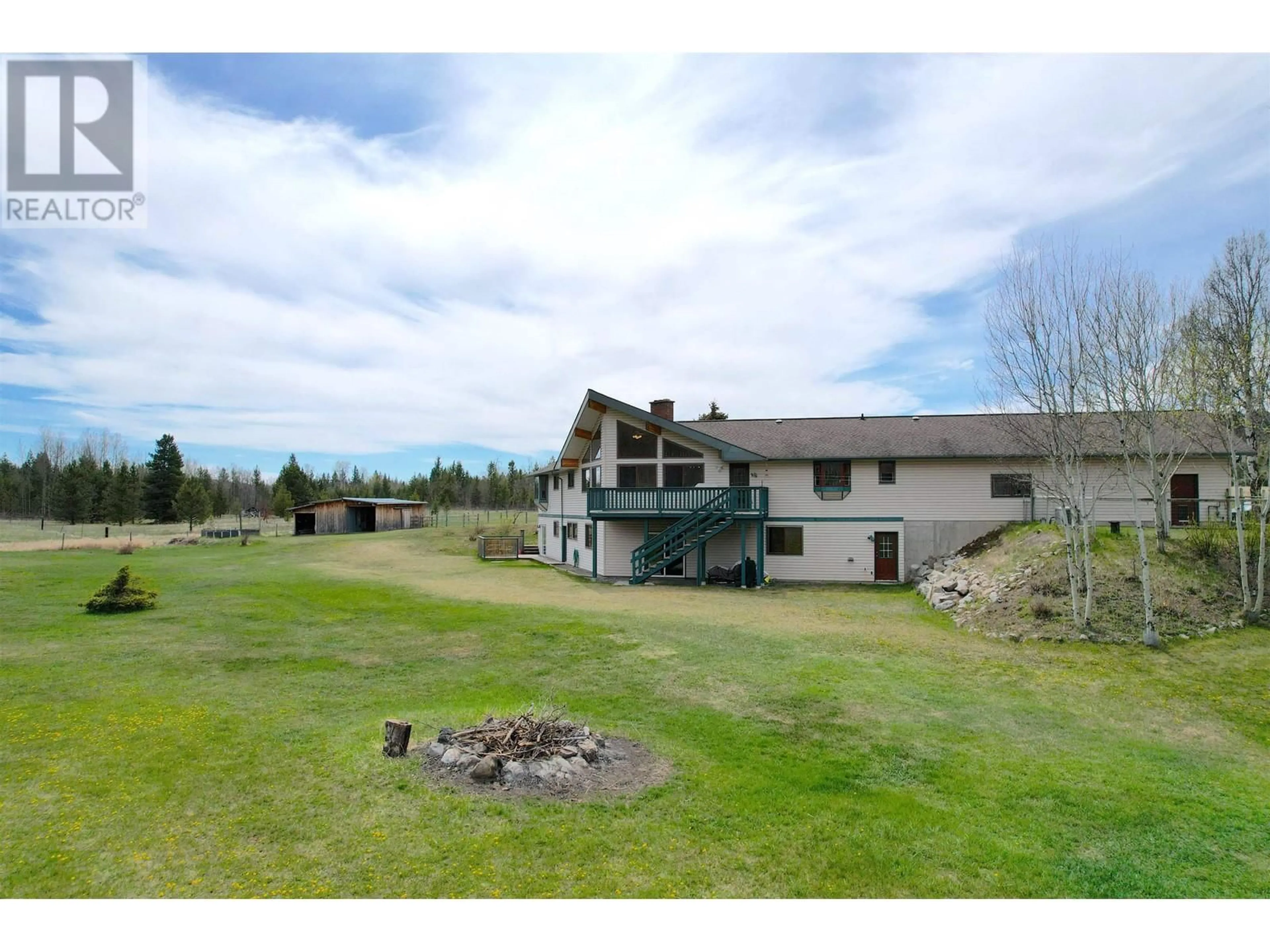 A pic from outside/outdoor area/front of a property/back of a property/a pic from drone, water/lake/river/ocean view for 4221 LODGE ROAD, Lac La Hache British Columbia V0K1T0