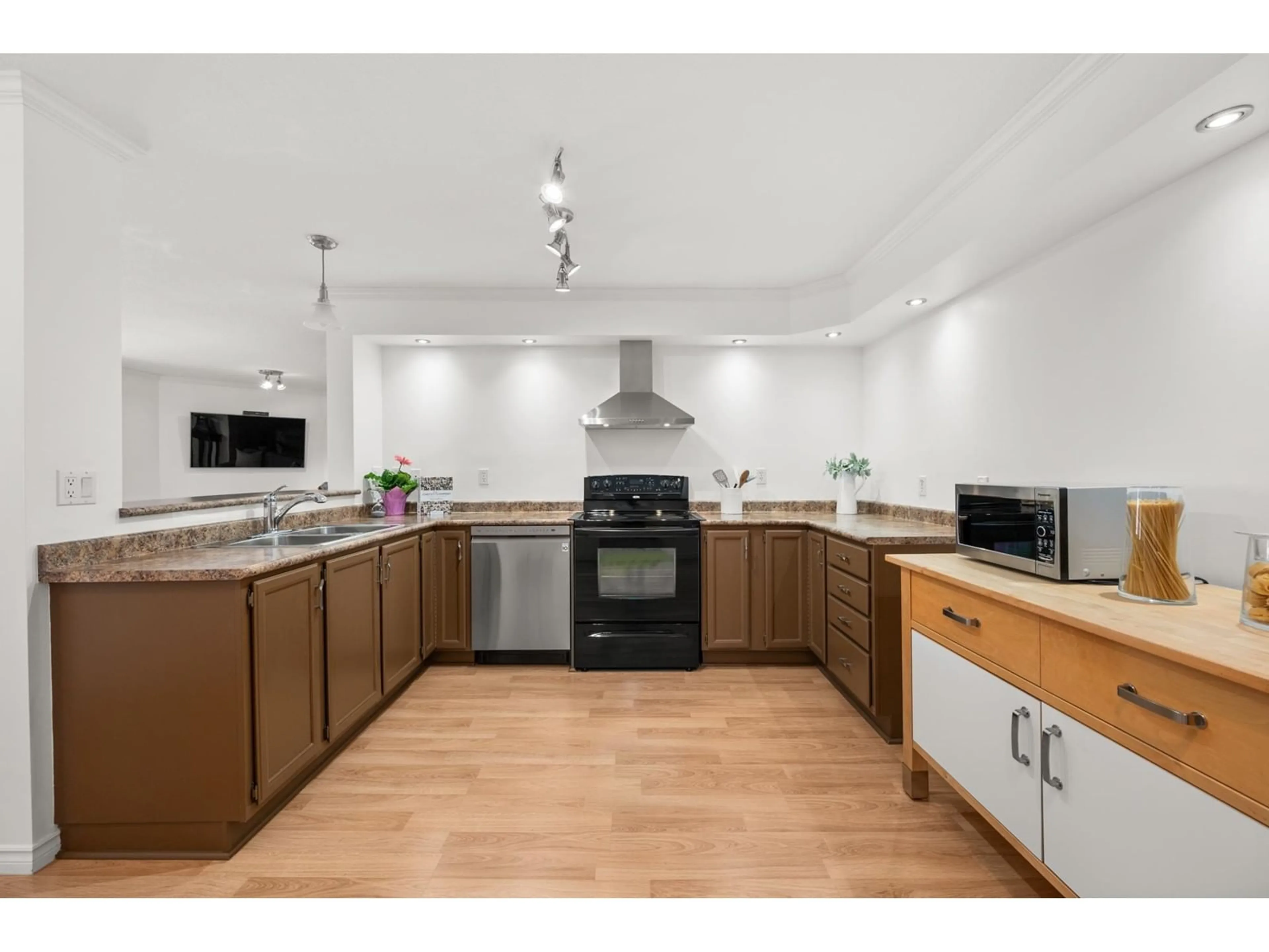 Open concept kitchen, wood/laminate floor for 205 9295 122 STREET, Surrey British Columbia V3L4L4