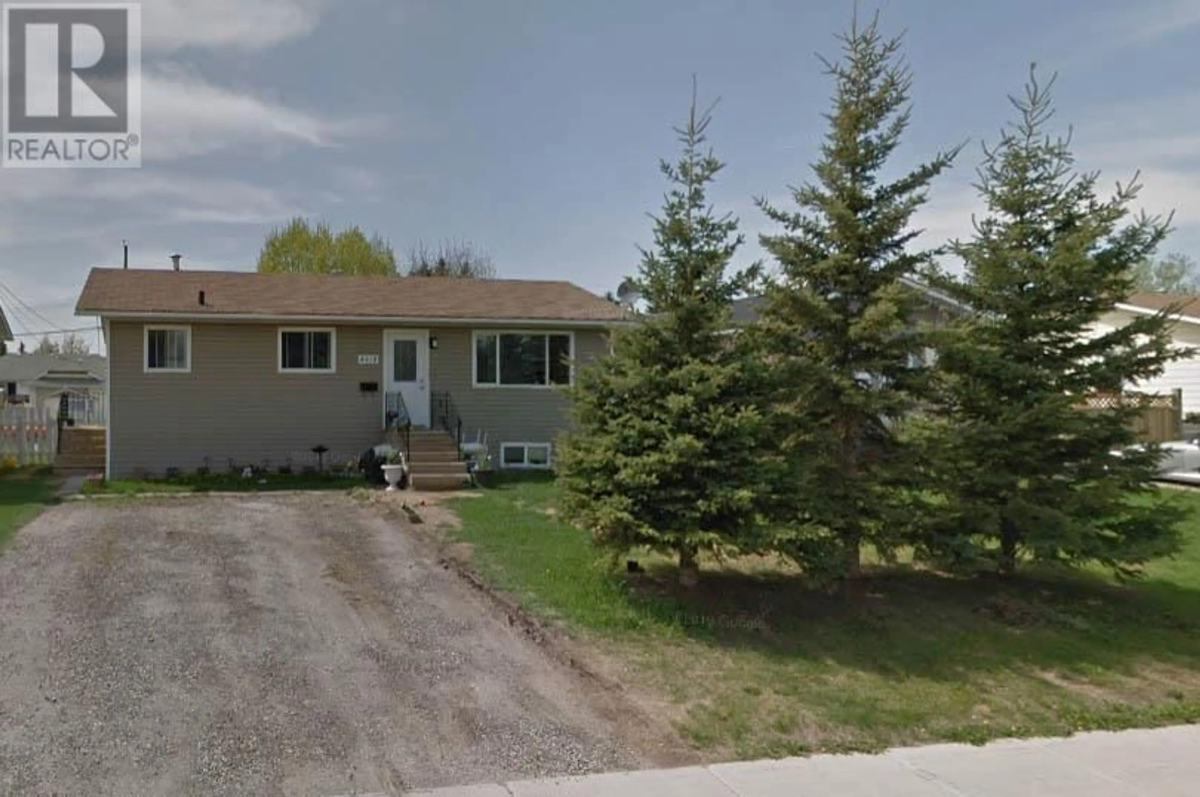 Home with vinyl exterior material, street for 8912 91 STREET, Fort St. John British Columbia V1J4R6