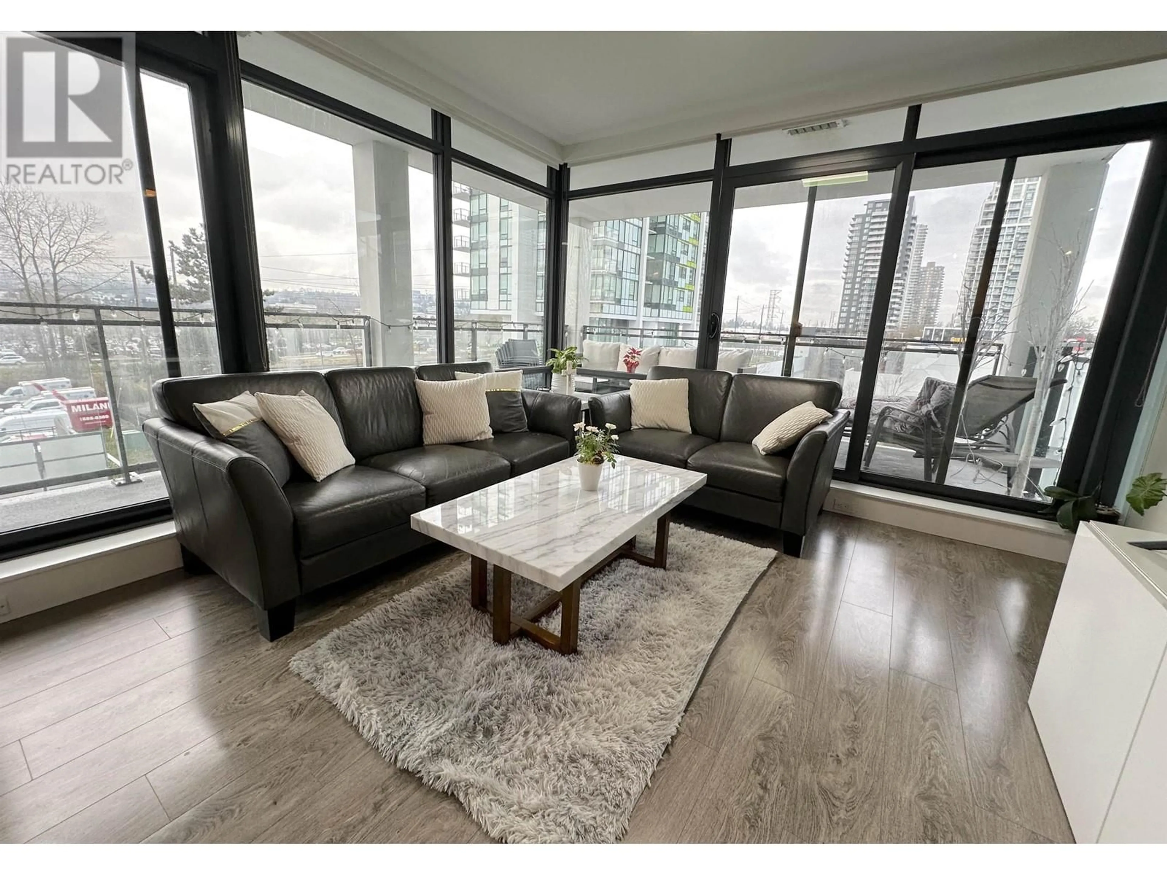 Living room with furniture, wood/laminate floor for 406 - 2378 ALPHA AVENUE, Burnaby British Columbia V5C0K2