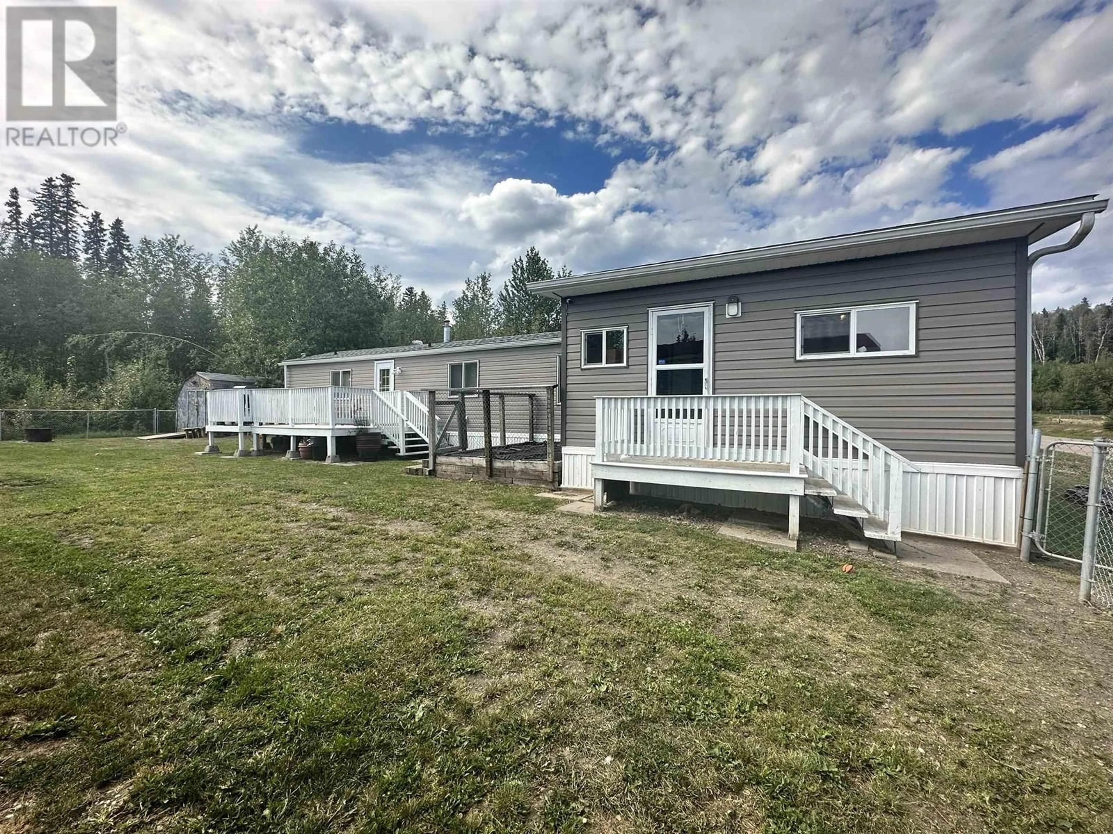 A pic from outside/outdoor area/front of a property/back of a property/a pic from drone, water/lake/river/ocean view for 16 - 5701 AIRPORT DRIVE, Fort Nelson British Columbia V0C1R0