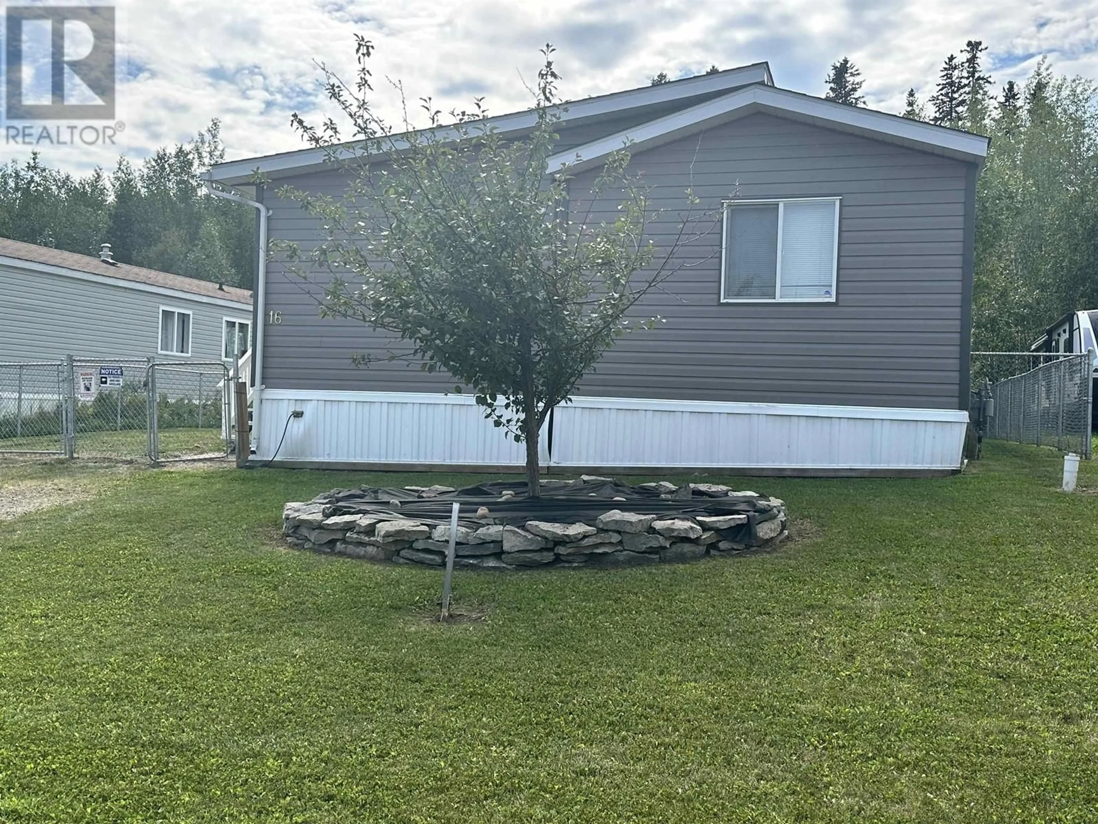 A pic from outside/outdoor area/front of a property/back of a property/a pic from drone, unknown for 16 5701 AIRPORT DRIVE, Fort Nelson British Columbia V0C1R0