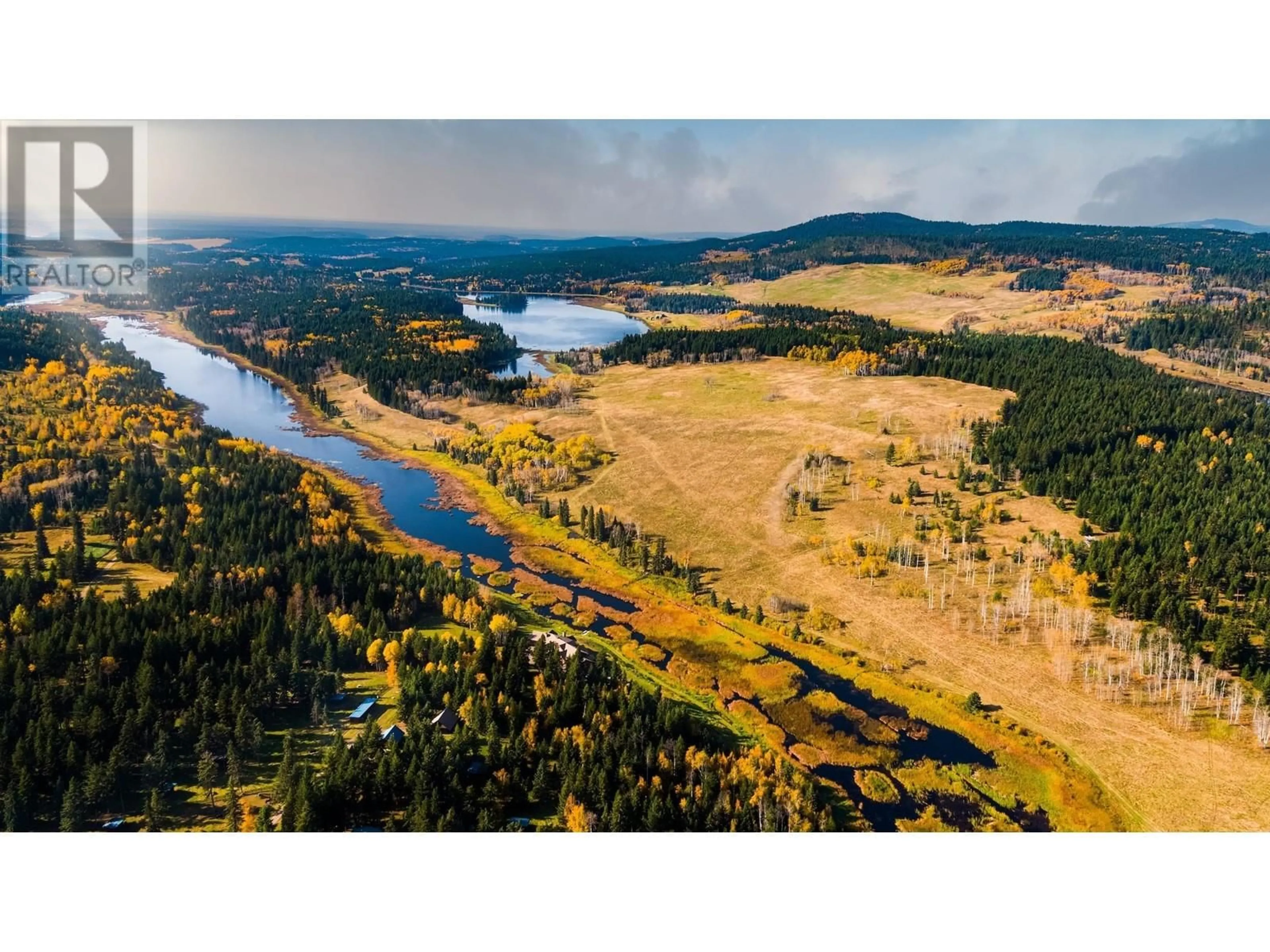A pic from outside/outdoor area/front of a property/back of a property/a pic from drone, water/lake/river/ocean view for 5957 THORSTEINSON ROAD, 100 Mile House British Columbia V0J1E0