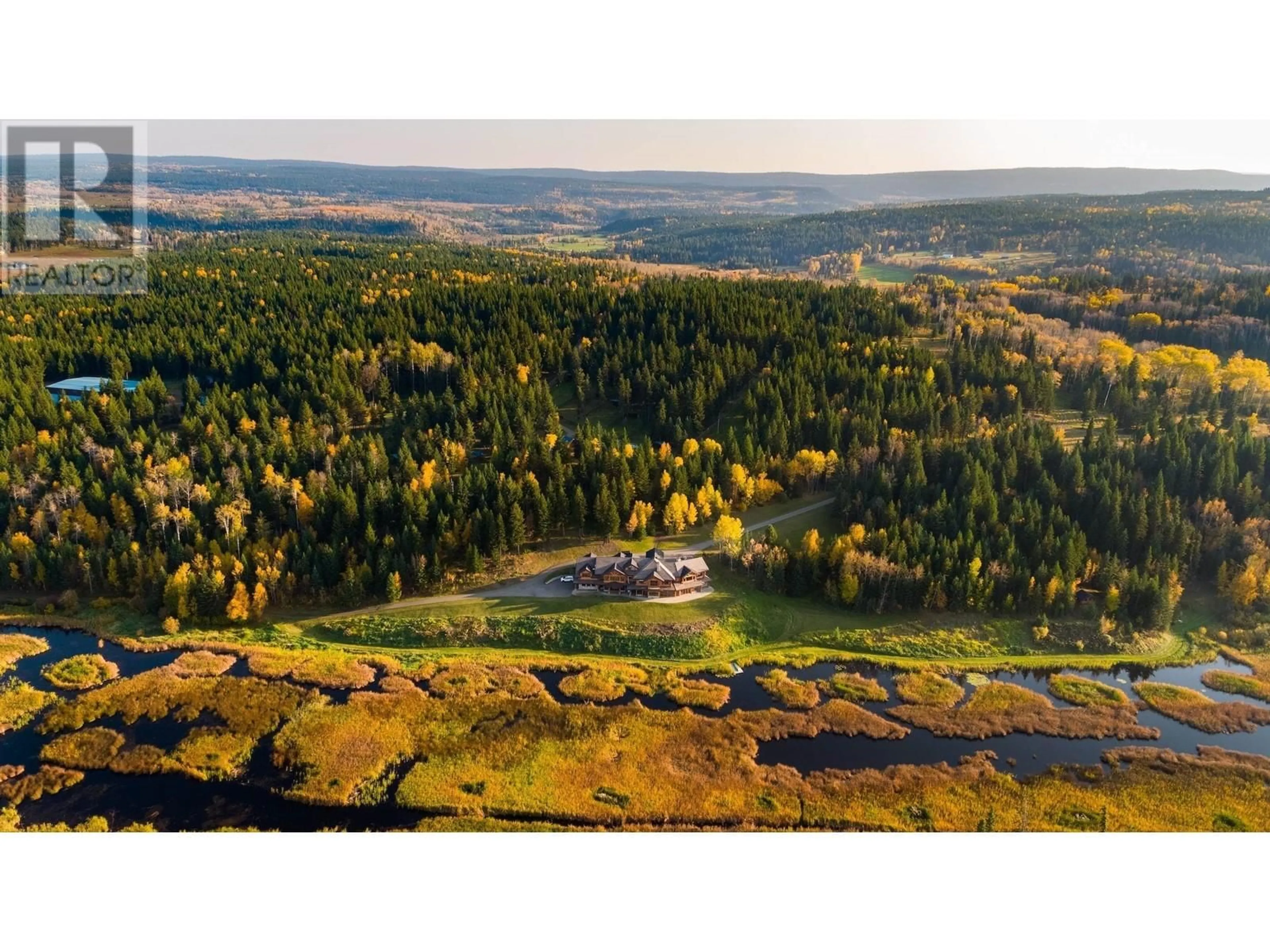 A pic from outside/outdoor area/front of a property/back of a property/a pic from drone, forest/trees view for 5957 THORSTEINSON ROAD, 100 Mile House British Columbia V0J1E0