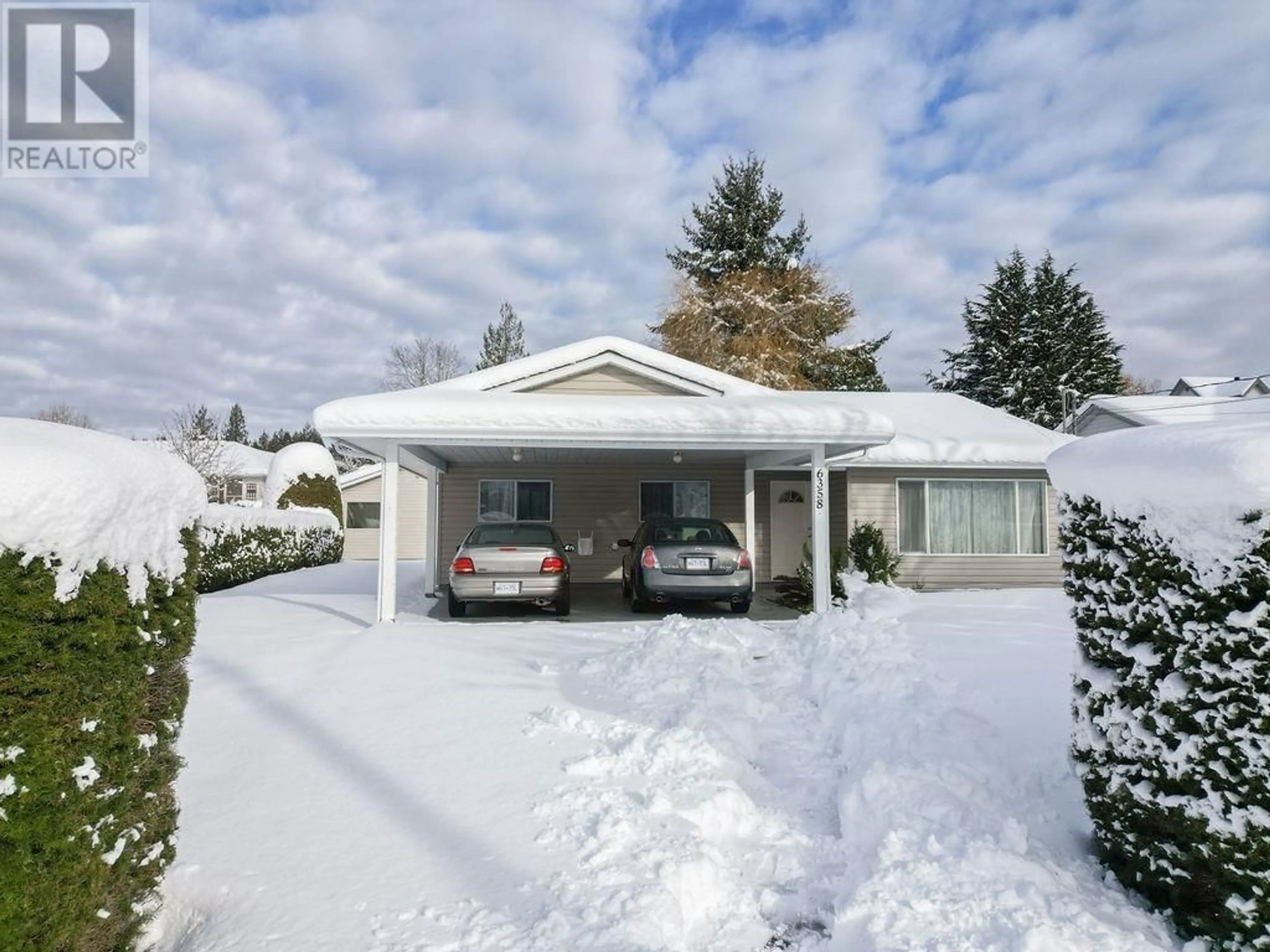 Home with vinyl exterior material, street for 6358 ORACLE ROAD, Sechelt British Columbia V7Z0R8