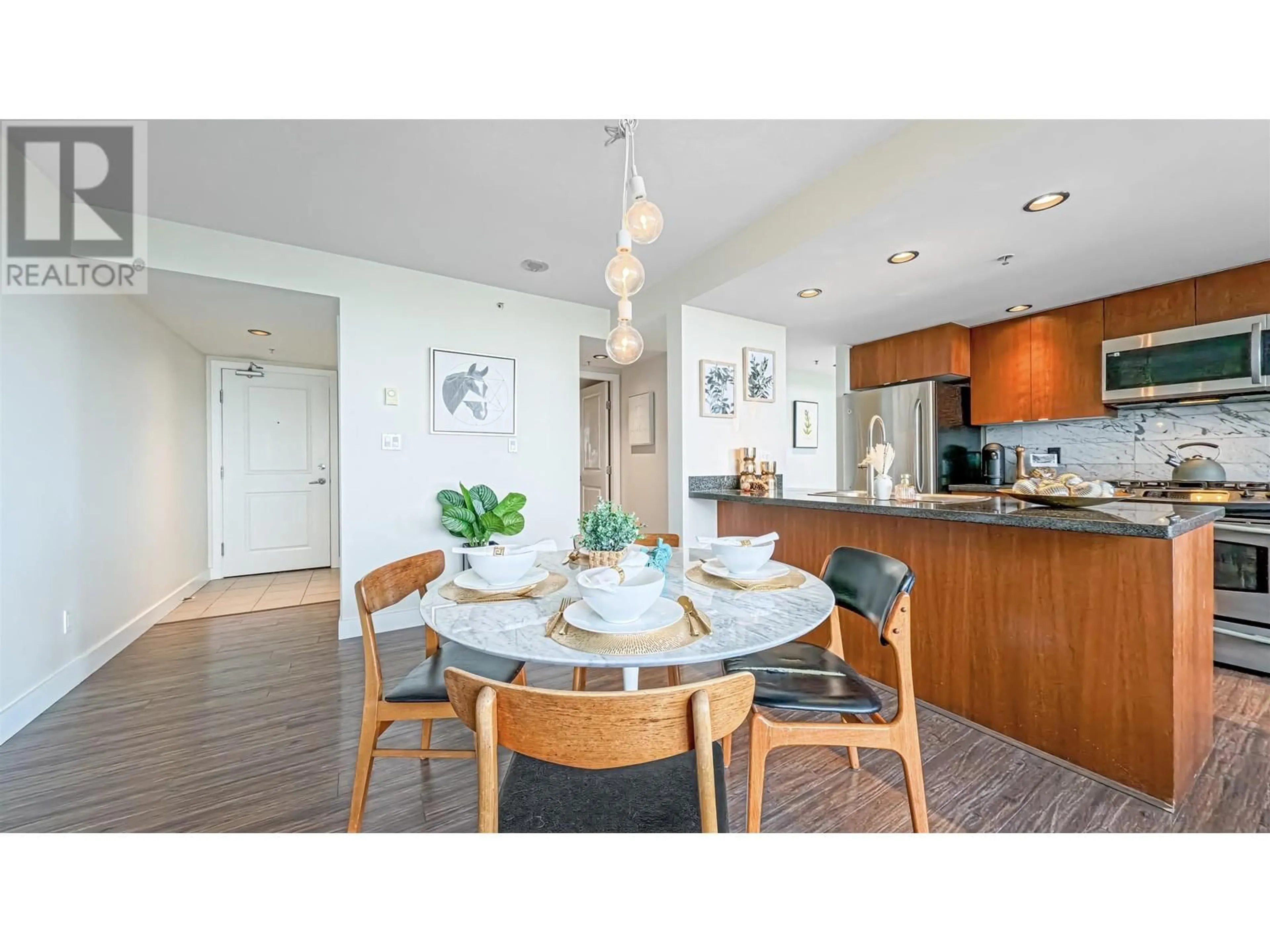 Open concept kitchen, wood/laminate floor for 1306 9180 HEMLOCK DRIVE, Richmond British Columbia V6Y4J5