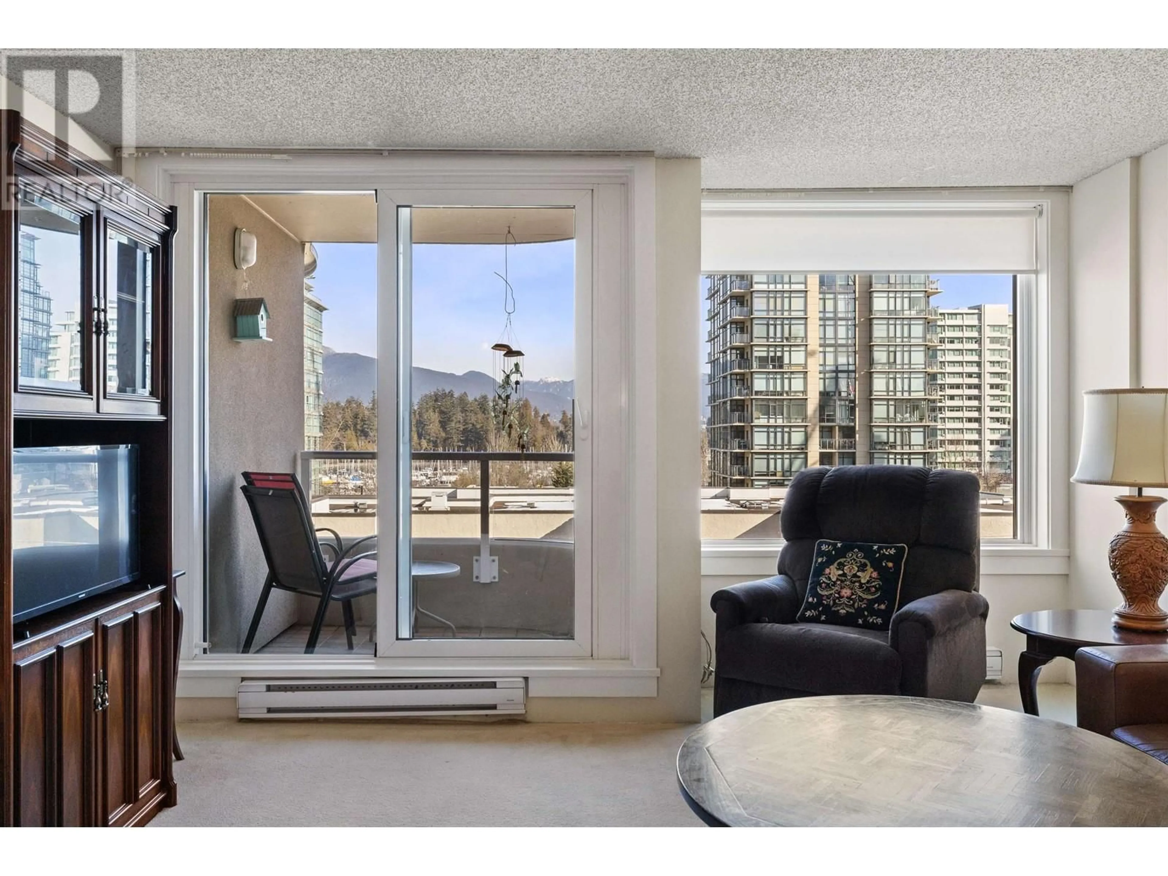 Living room with furniture, wood/laminate floor for 502 1845 ROBSON STREET, Vancouver British Columbia V6G1E4