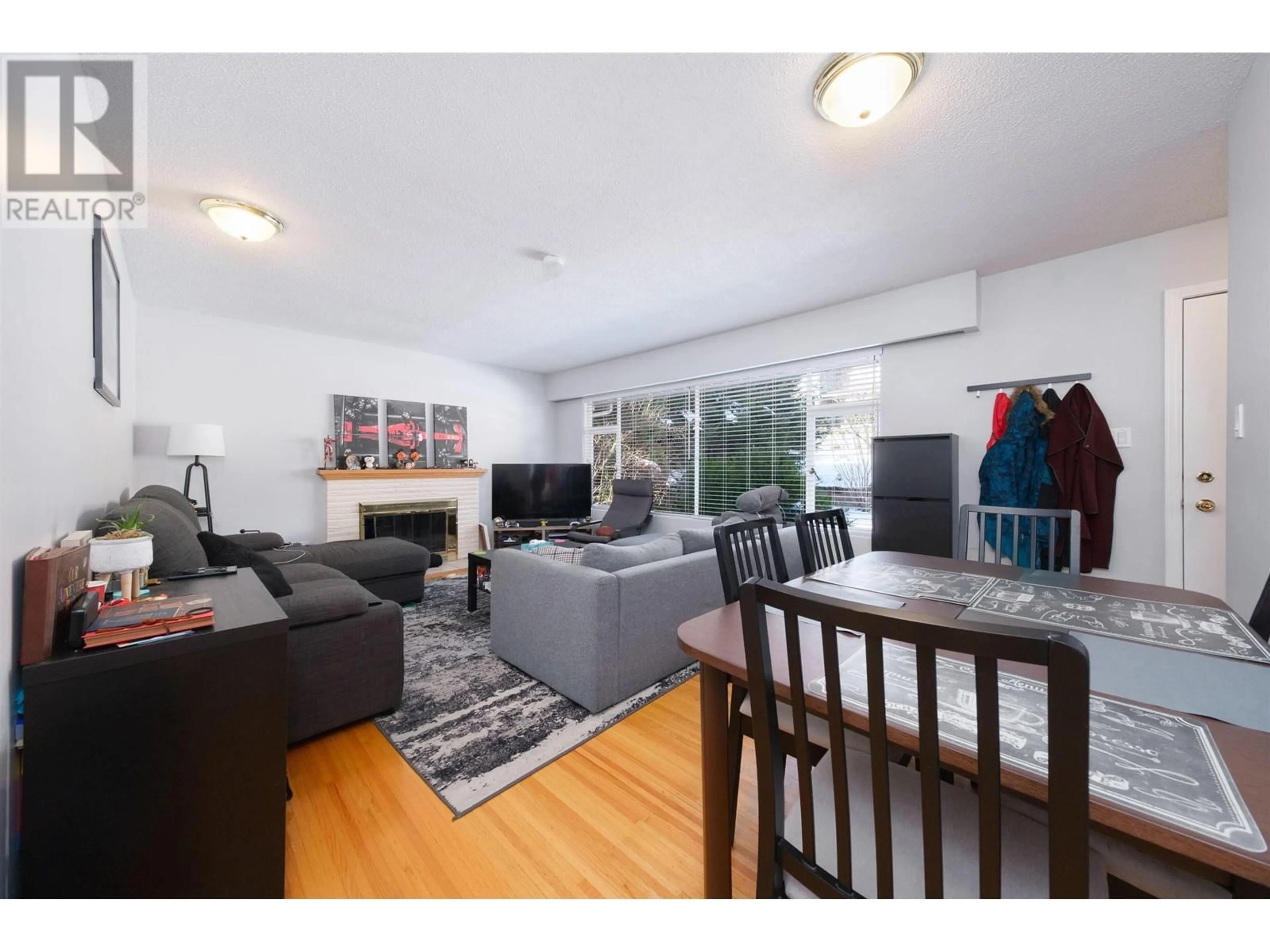 Living room with furniture, wood/laminate floor for 1059 CALVERHALL STREET, North Vancouver British Columbia V7L1Y4