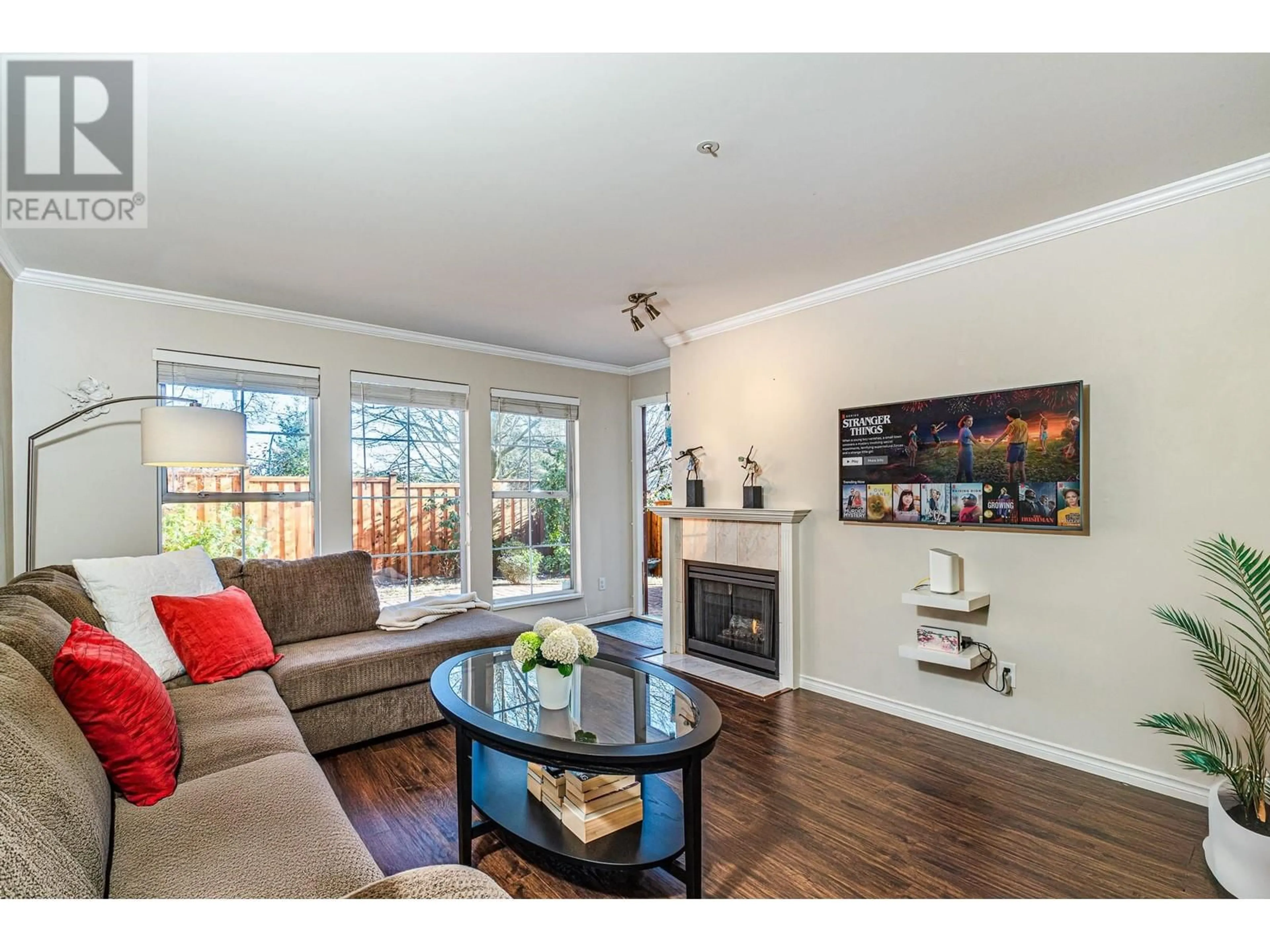 Living room with furniture, wood/laminate floor for 207 888 GAUTHIER AVENUE, Coquitlam British Columbia V3K6Y1