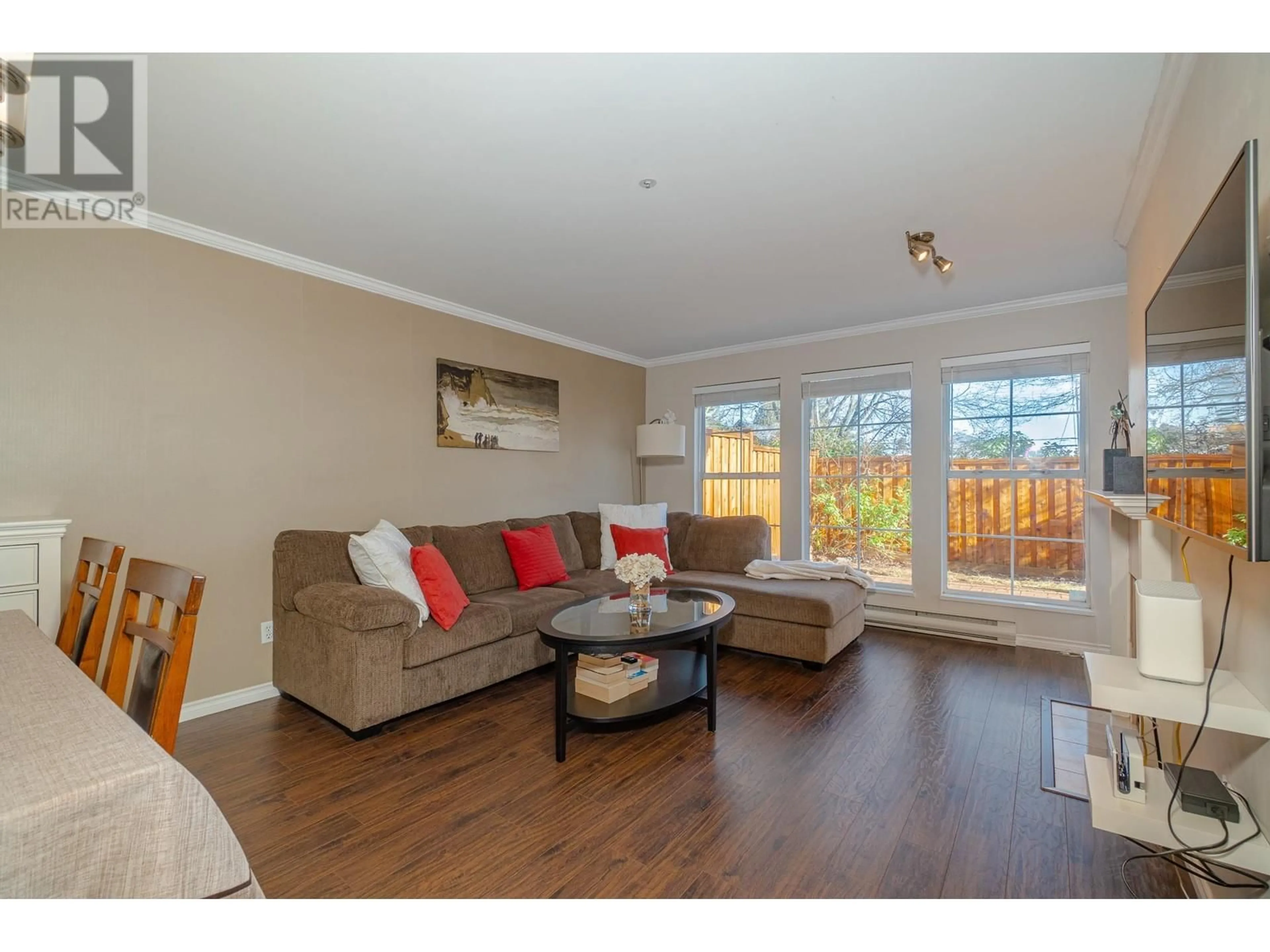 Living room with furniture, wood/laminate floor for 207 888 GAUTHIER AVENUE, Coquitlam British Columbia V3K6Y1