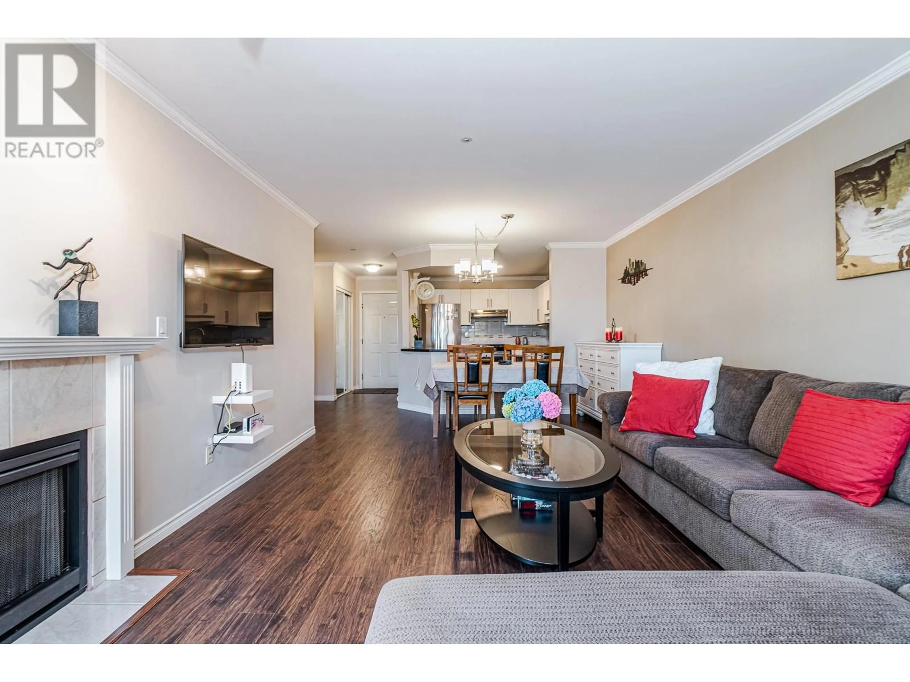 Living room with furniture, wood/laminate floor for 207 888 GAUTHIER AVENUE, Coquitlam British Columbia V3K6Y1