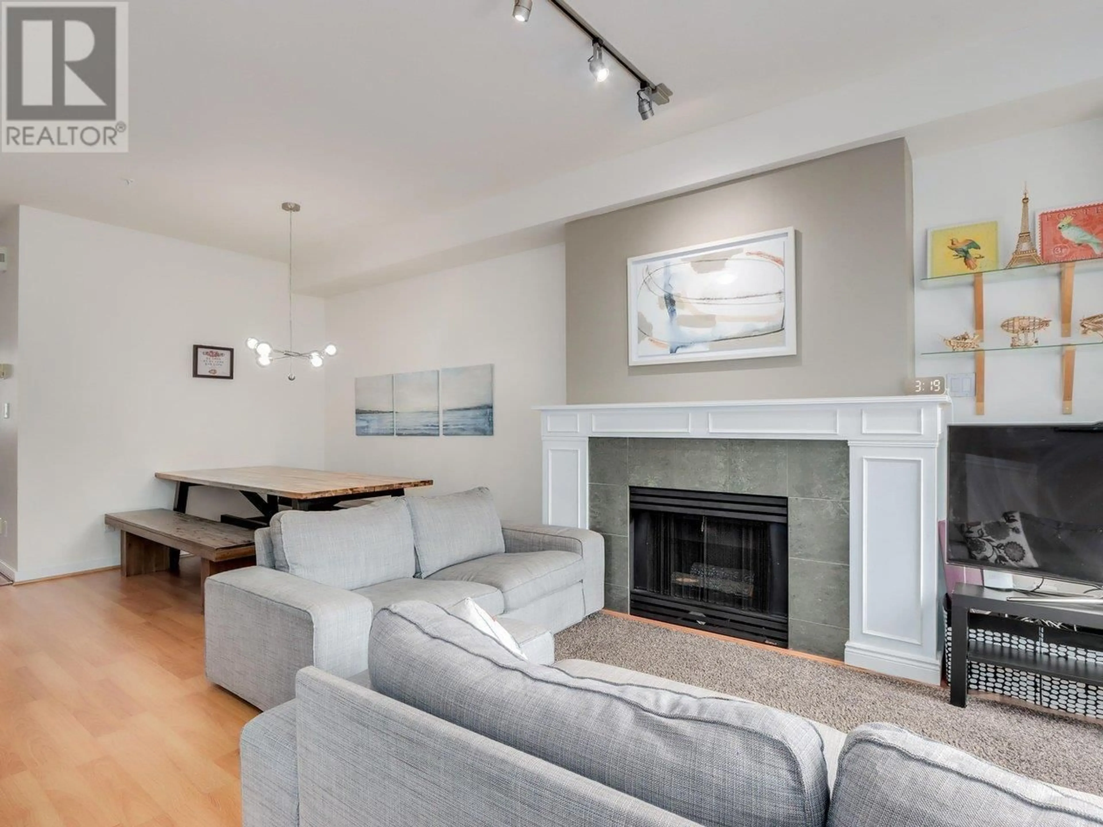 Living room with furniture, wood/laminate floor for 3229 PERROT MEWS, Vancouver British Columbia V5Z4W4