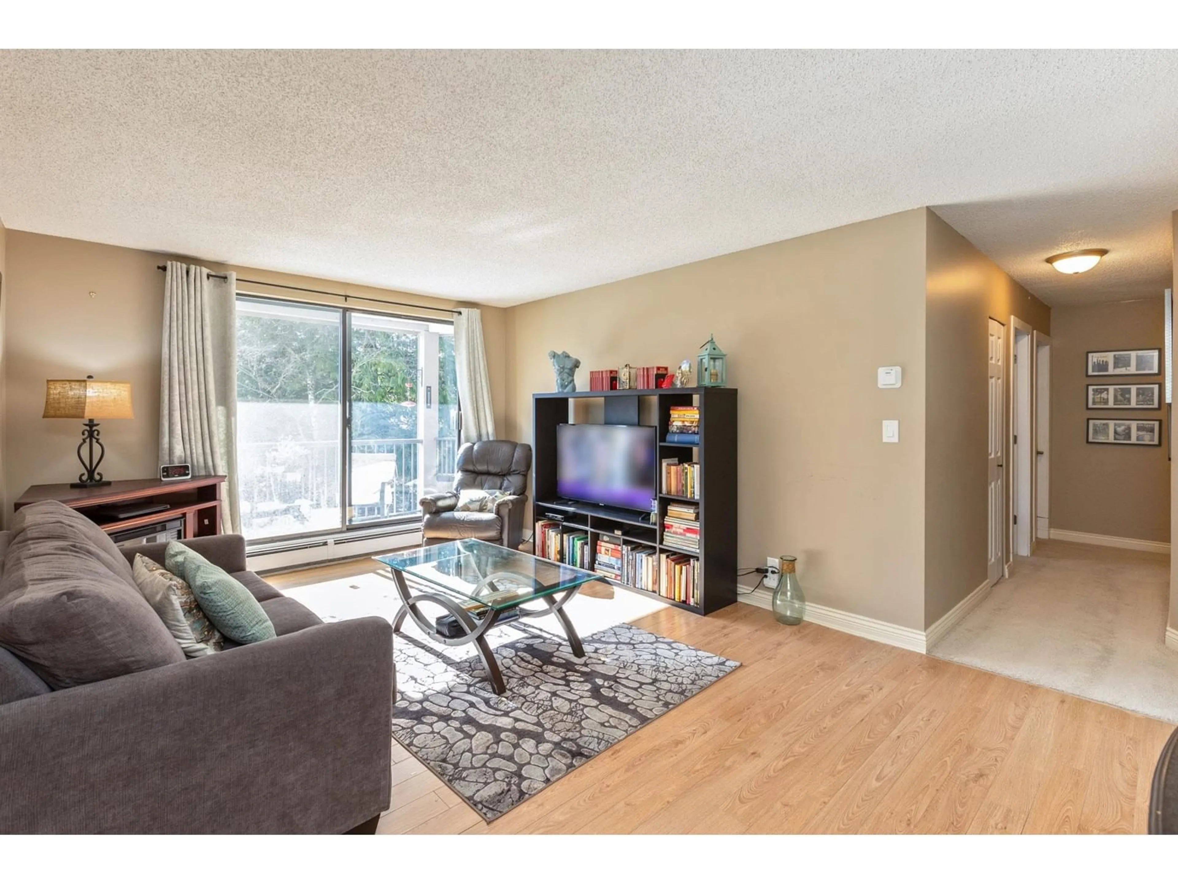 Living room with furniture, wood/laminate floor for 206 - 1740 SOUTHMERE, Surrey British Columbia V4A6E4