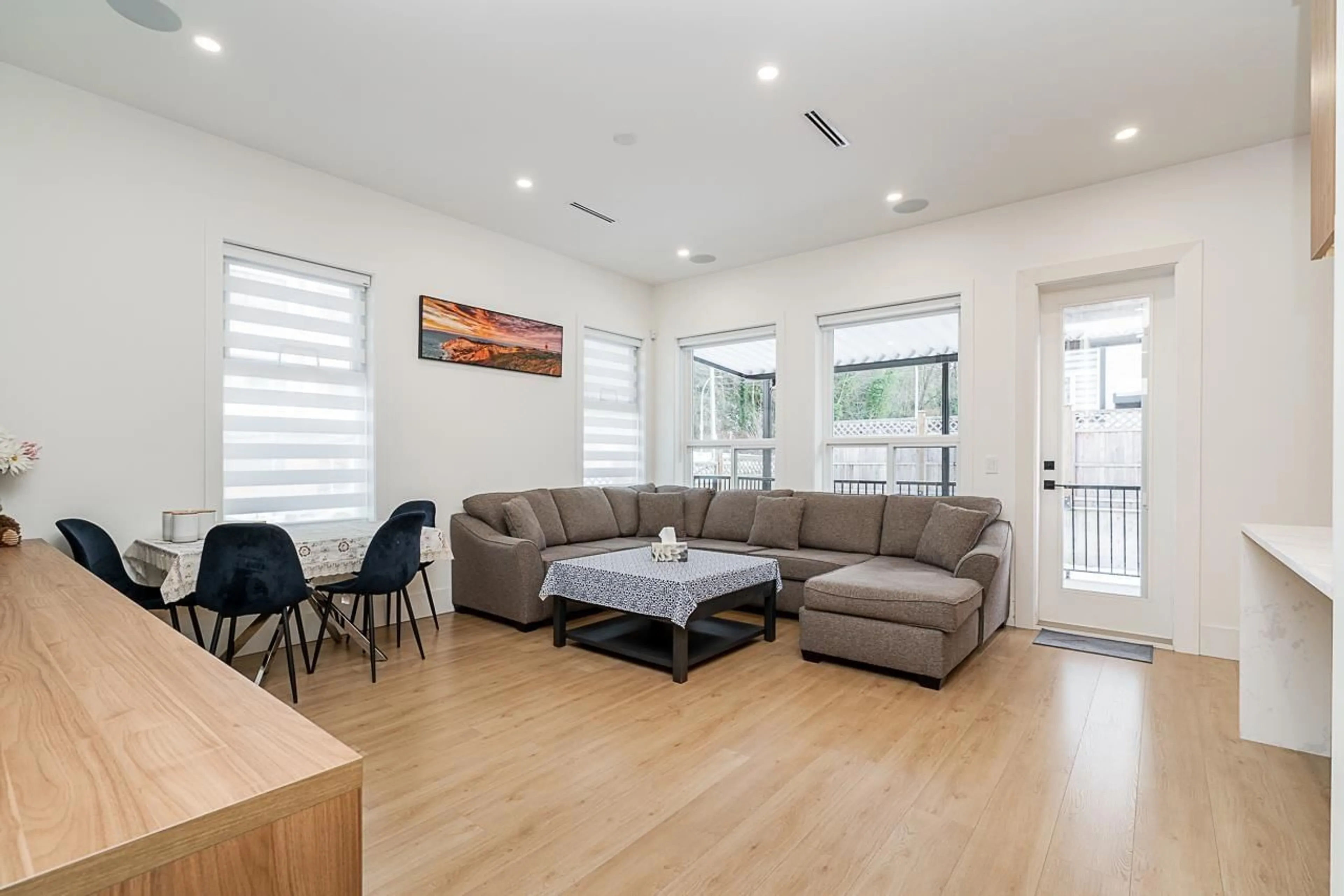 Living room with furniture, wood/laminate floor for 13098 112A AVENUE, Surrey British Columbia V3T2S8