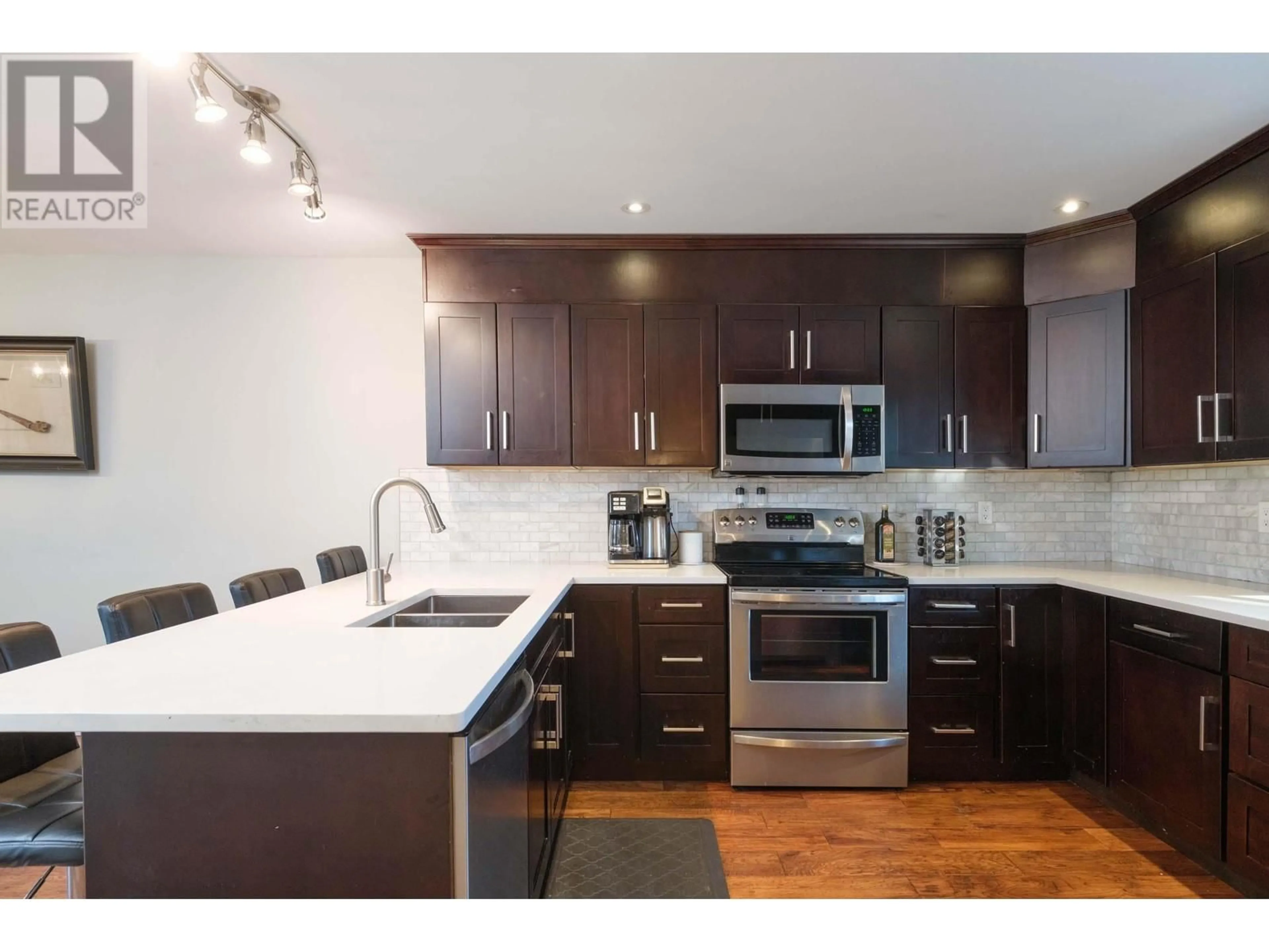 Open concept kitchen, wood/laminate floor for 1290 PREMIER STREET, North Vancouver British Columbia V7J2H4