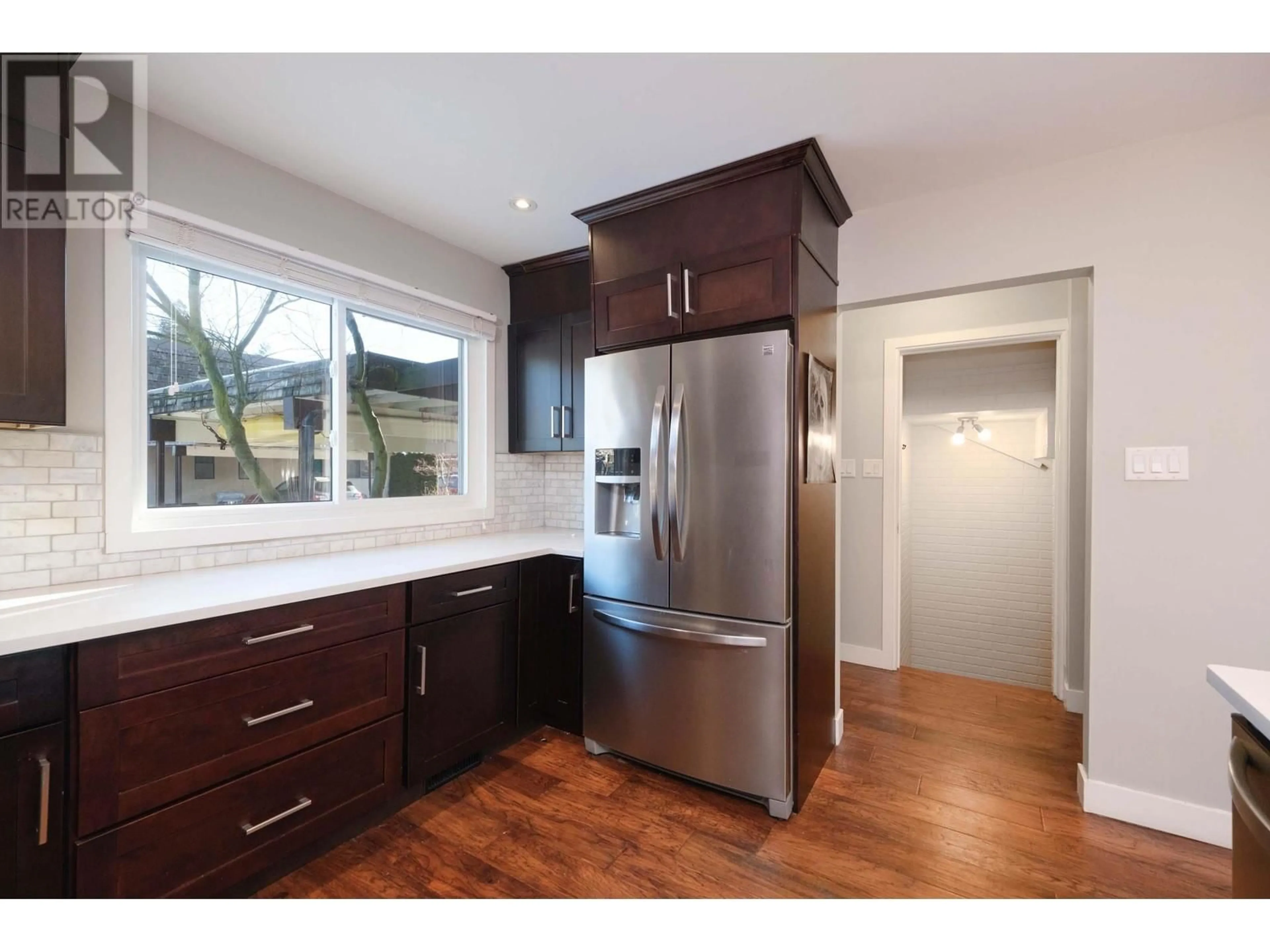 Open concept kitchen, wood/laminate floor for 1290 PREMIER STREET, North Vancouver British Columbia V7J2H4