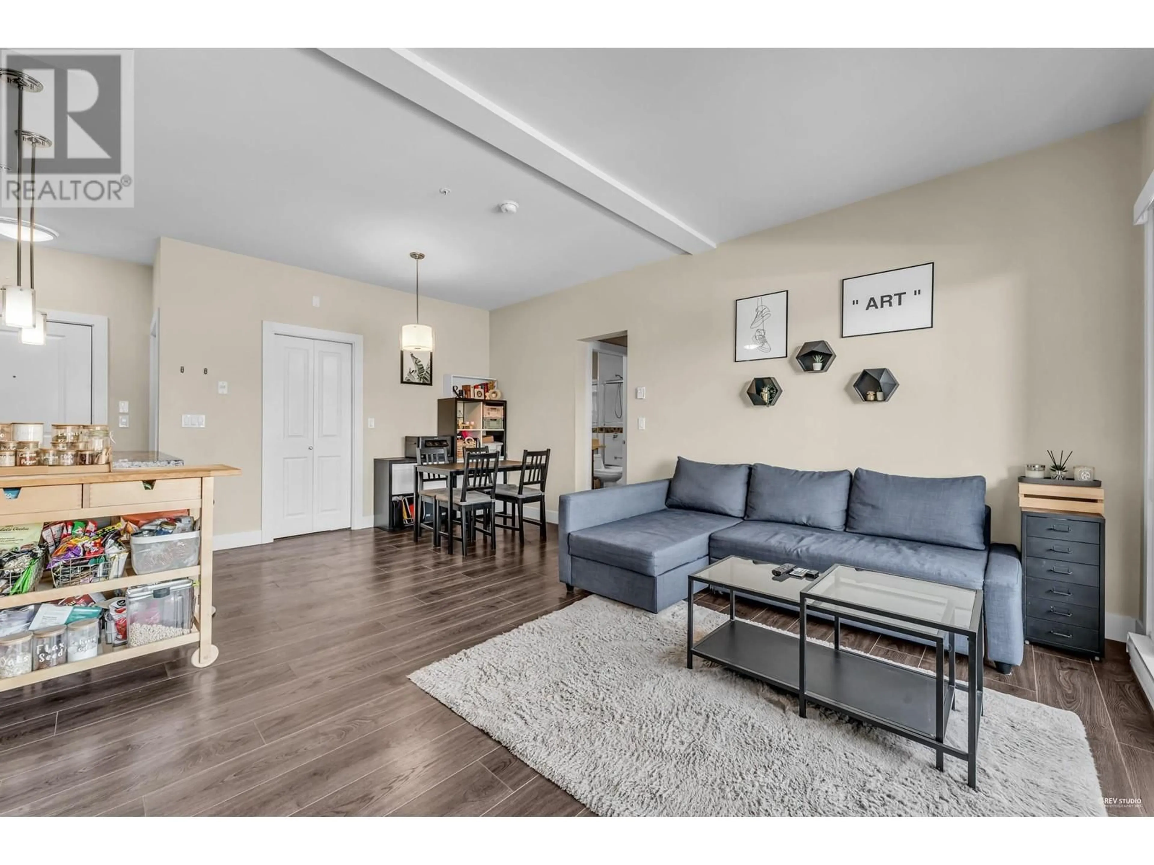 Living room with furniture, wood/laminate floor for 212 7377 14TH AVENUE, Burnaby British Columbia V3N1Z7