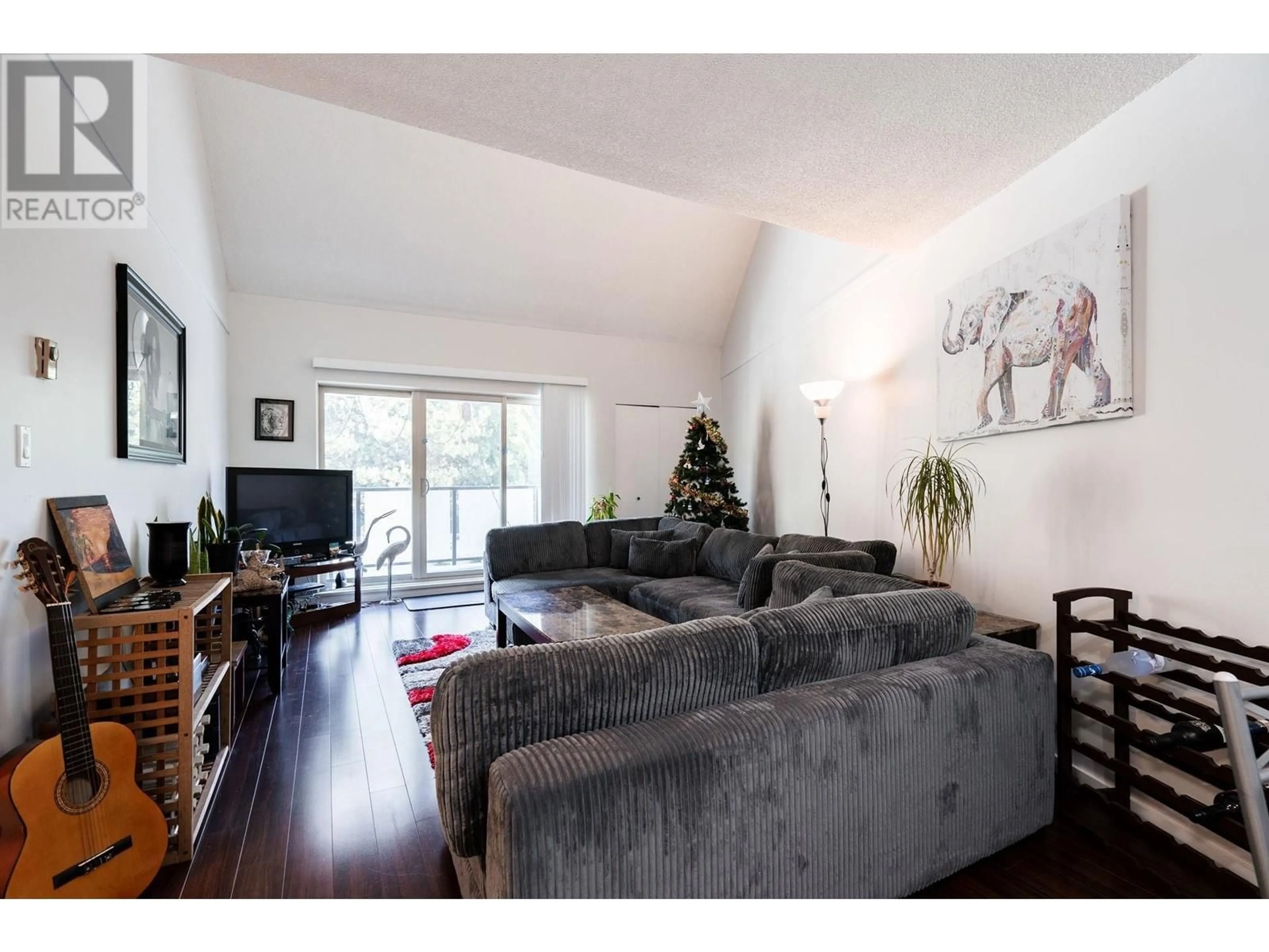 Living room with furniture, wood/laminate floor for 417 4373 HALIFAX STREET, Burnaby British Columbia V5C5Z2