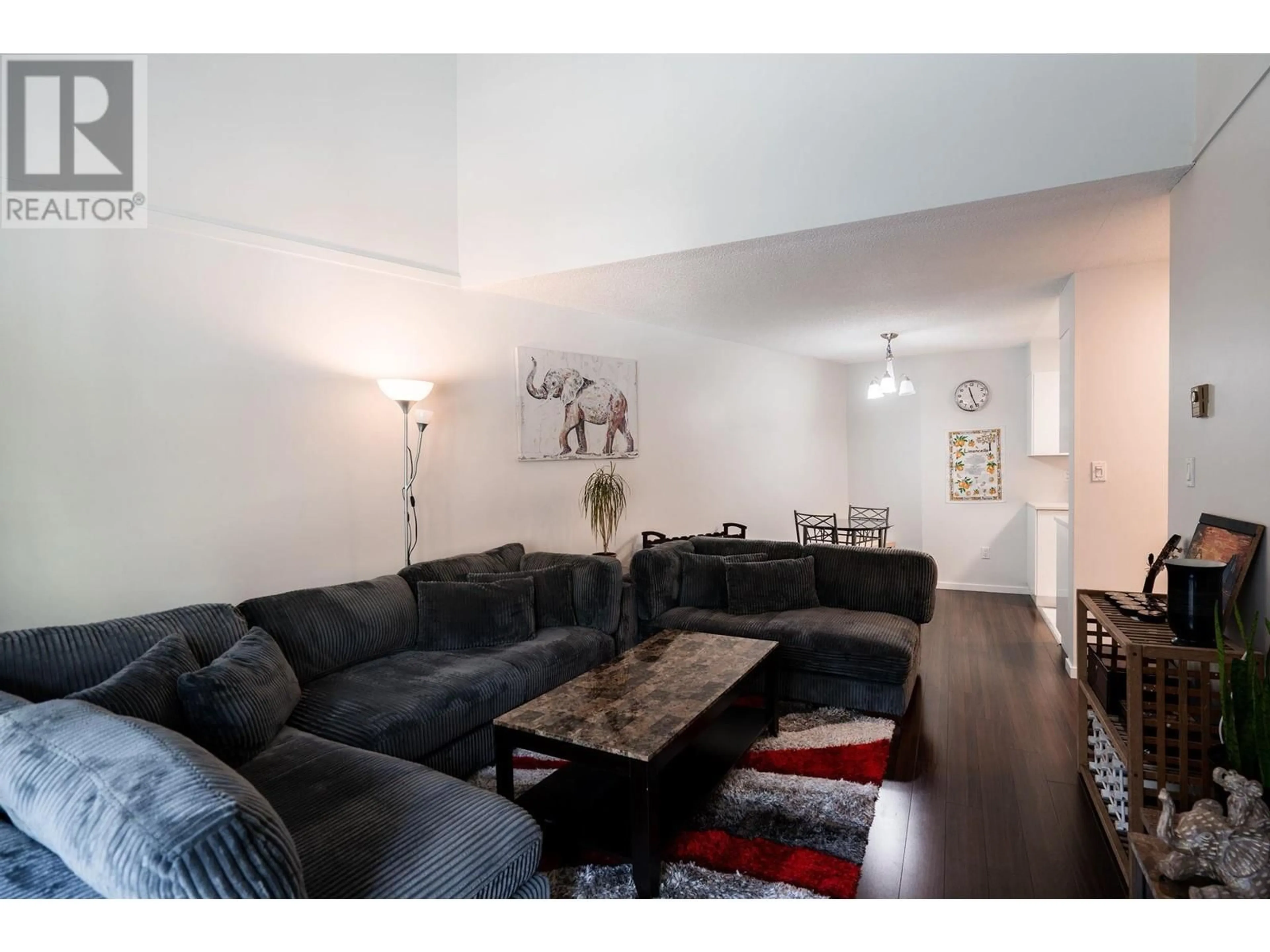 Living room with furniture, wood/laminate floor for 417 4373 HALIFAX STREET, Burnaby British Columbia V5C5Z2