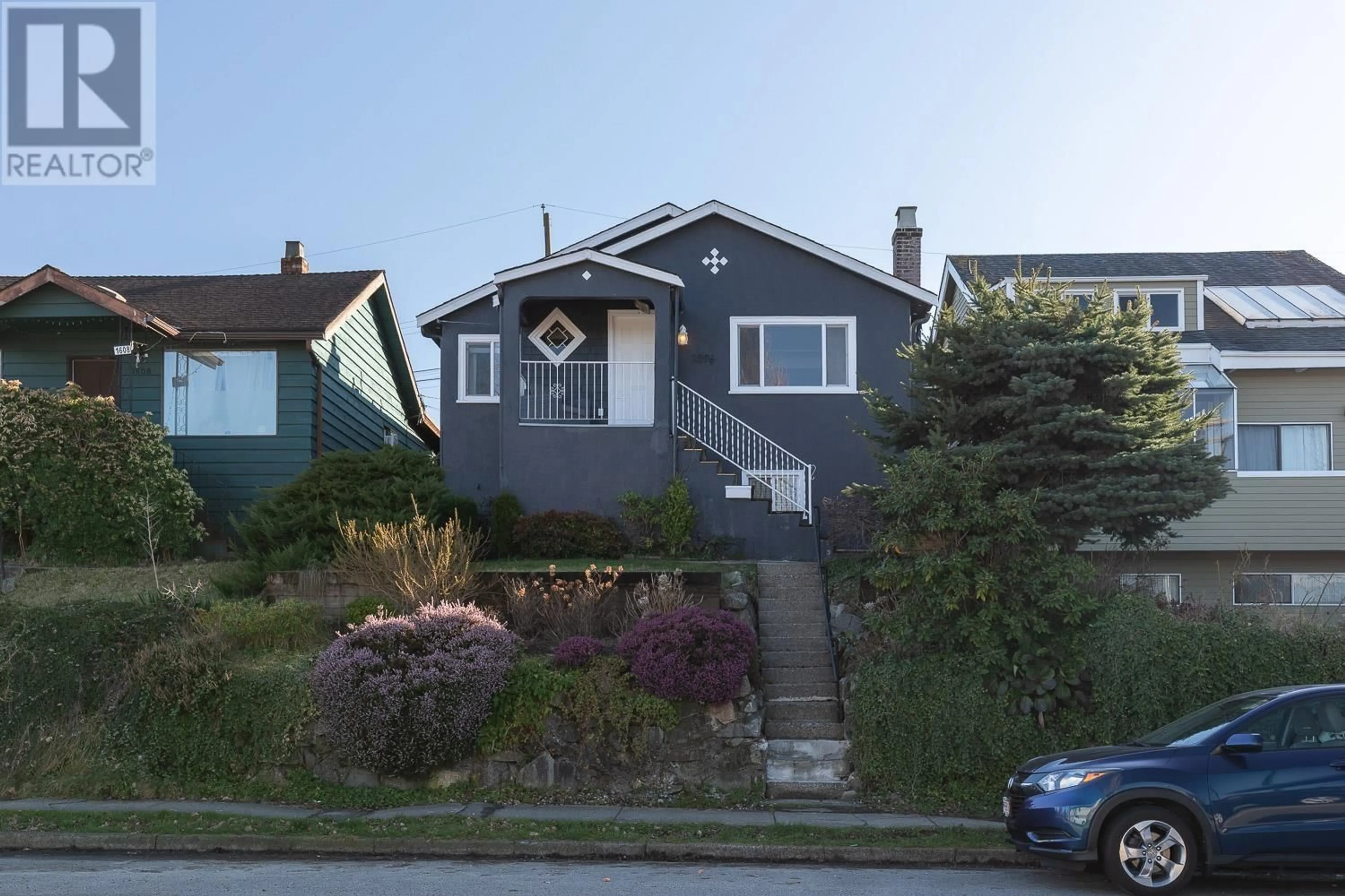 Home with vinyl exterior material, street for 1596 33RD AVENUE, Vancouver British Columbia V5N3C8