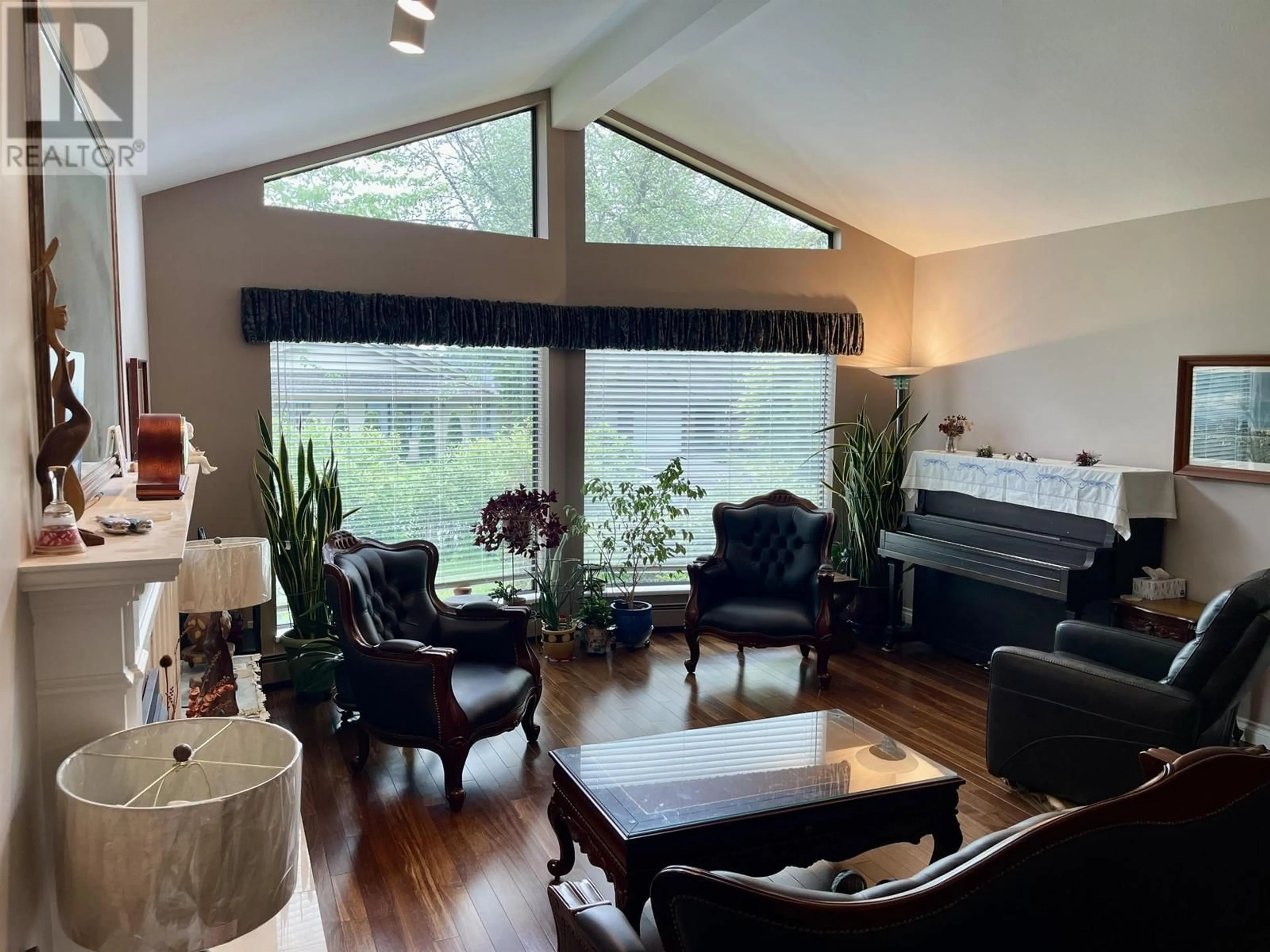 Living room with furniture, wood/laminate floor for 7984 MEADOWOOD DRIVE, Burnaby British Columbia V5A4J2