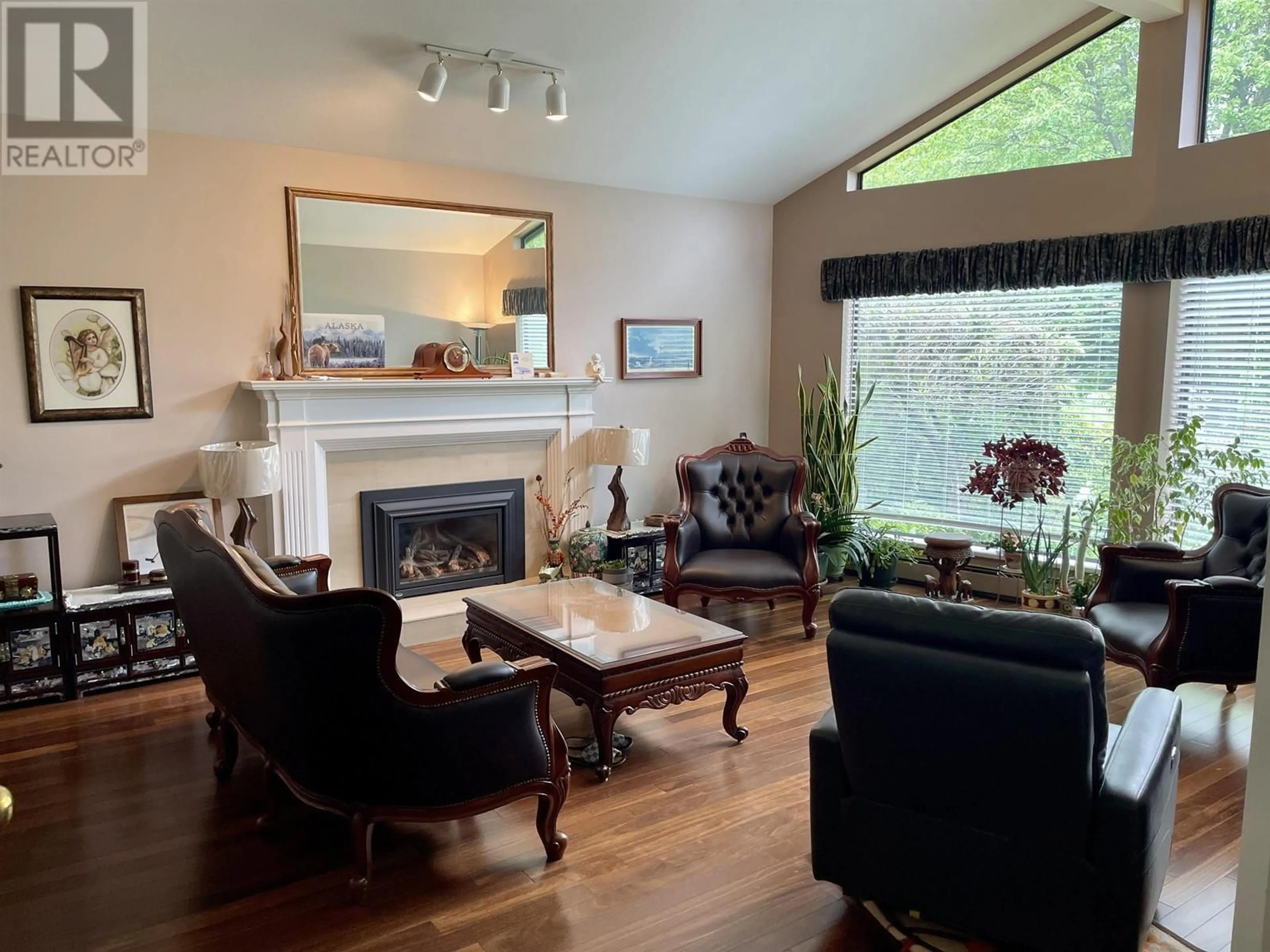 Living room with furniture, wood/laminate floor for 7984 MEADOWOOD DRIVE, Burnaby British Columbia V5A4J2