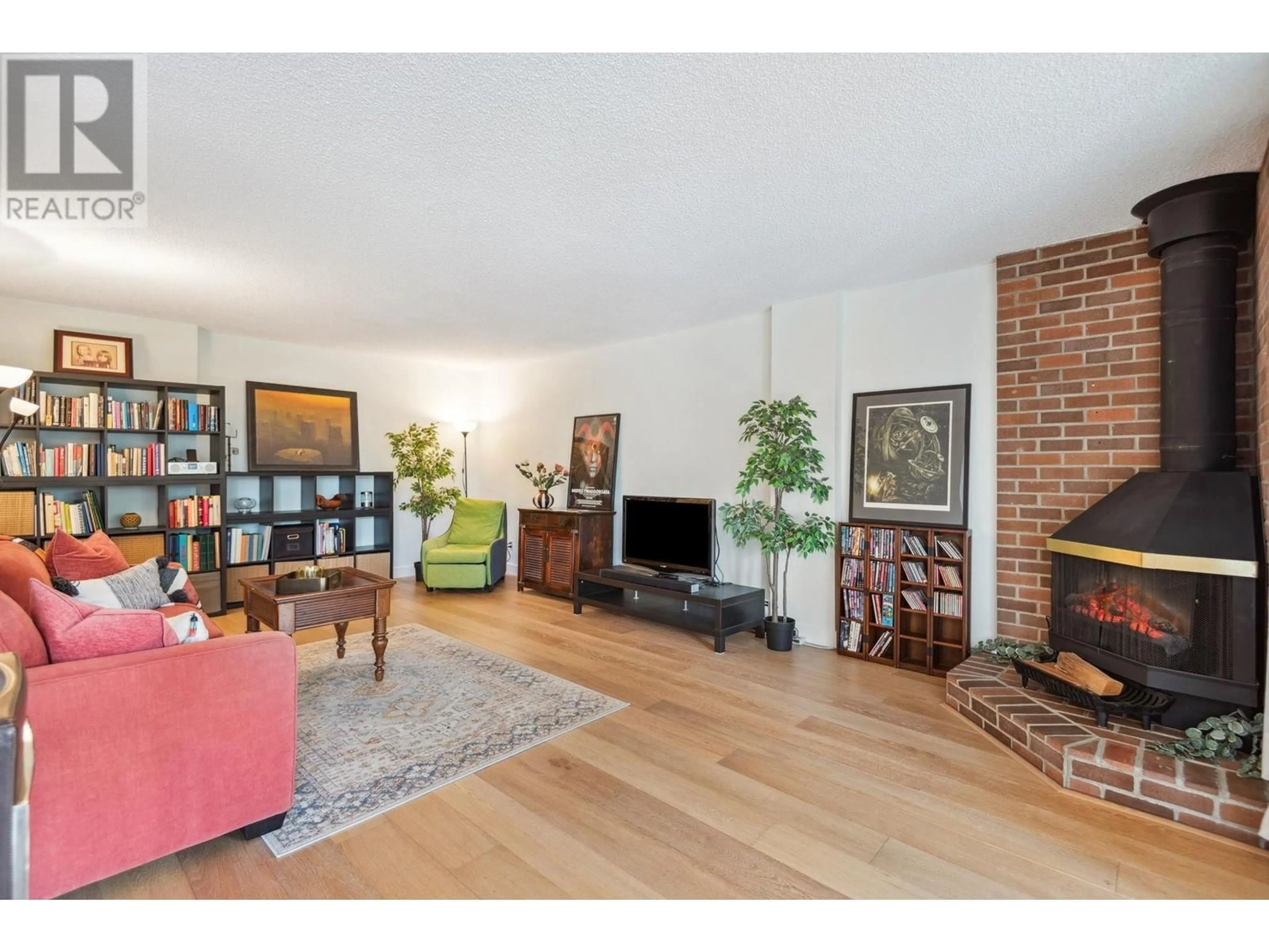 Living room with furniture, wood/laminate floor for 608 2101 MCMULLEN AVENUE, Vancouver British Columbia V6L3B4