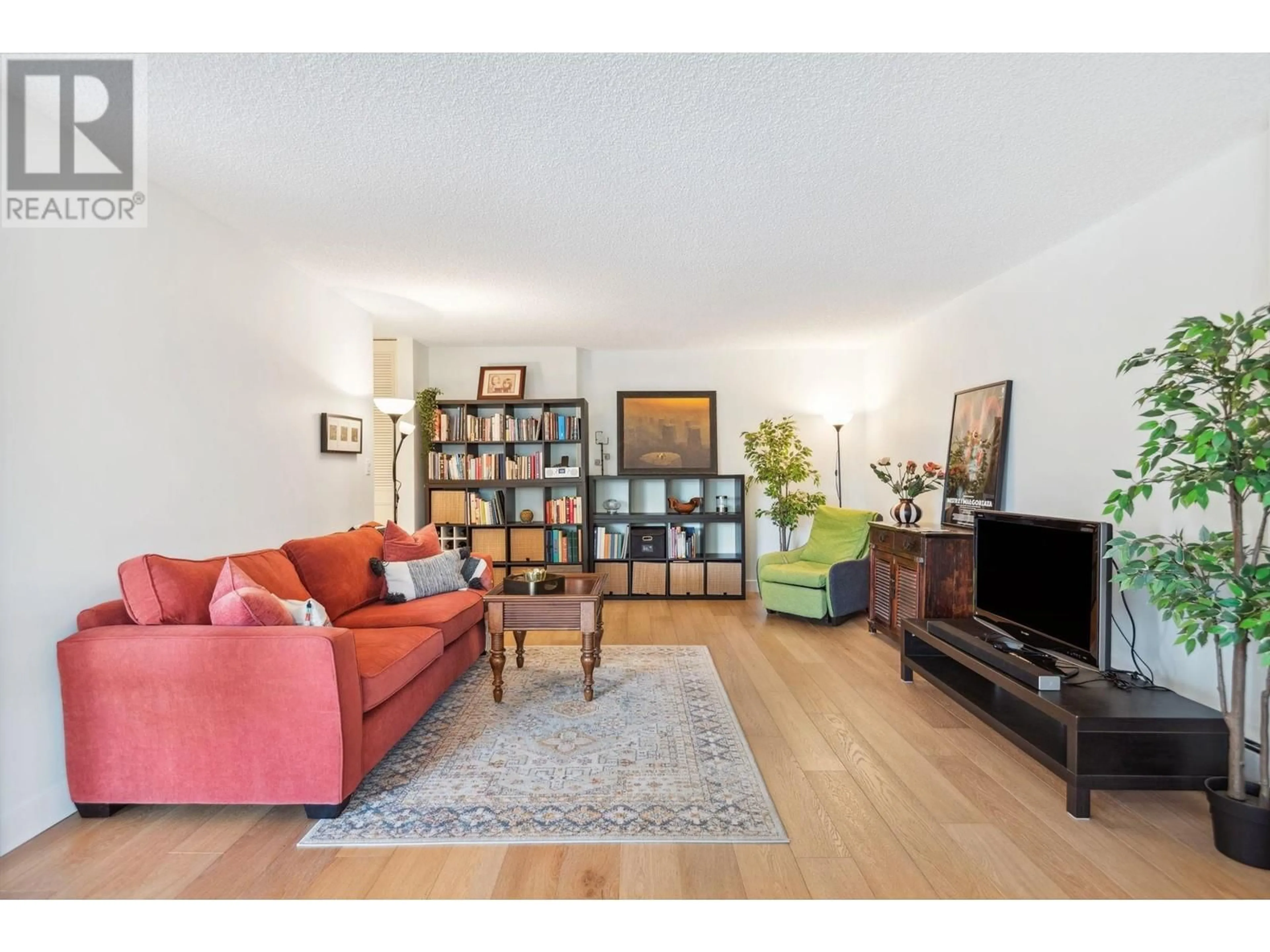 Living room with furniture, wood/laminate floor for 608 2101 MCMULLEN AVENUE, Vancouver British Columbia V6L3B4