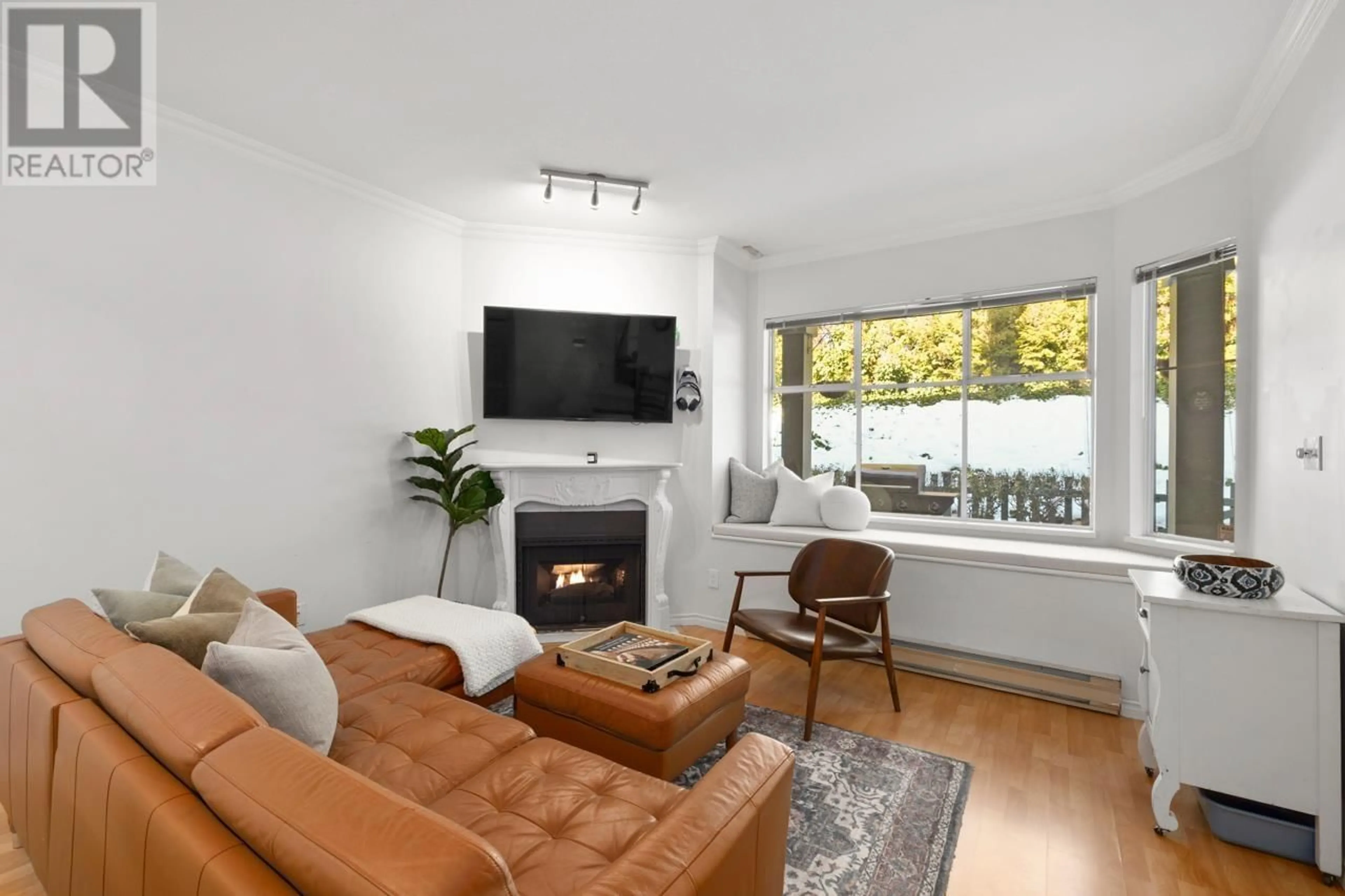 Living room with furniture, wood/laminate floor for 29 5988 HASTINGS STREET, Burnaby British Columbia V5B1R6