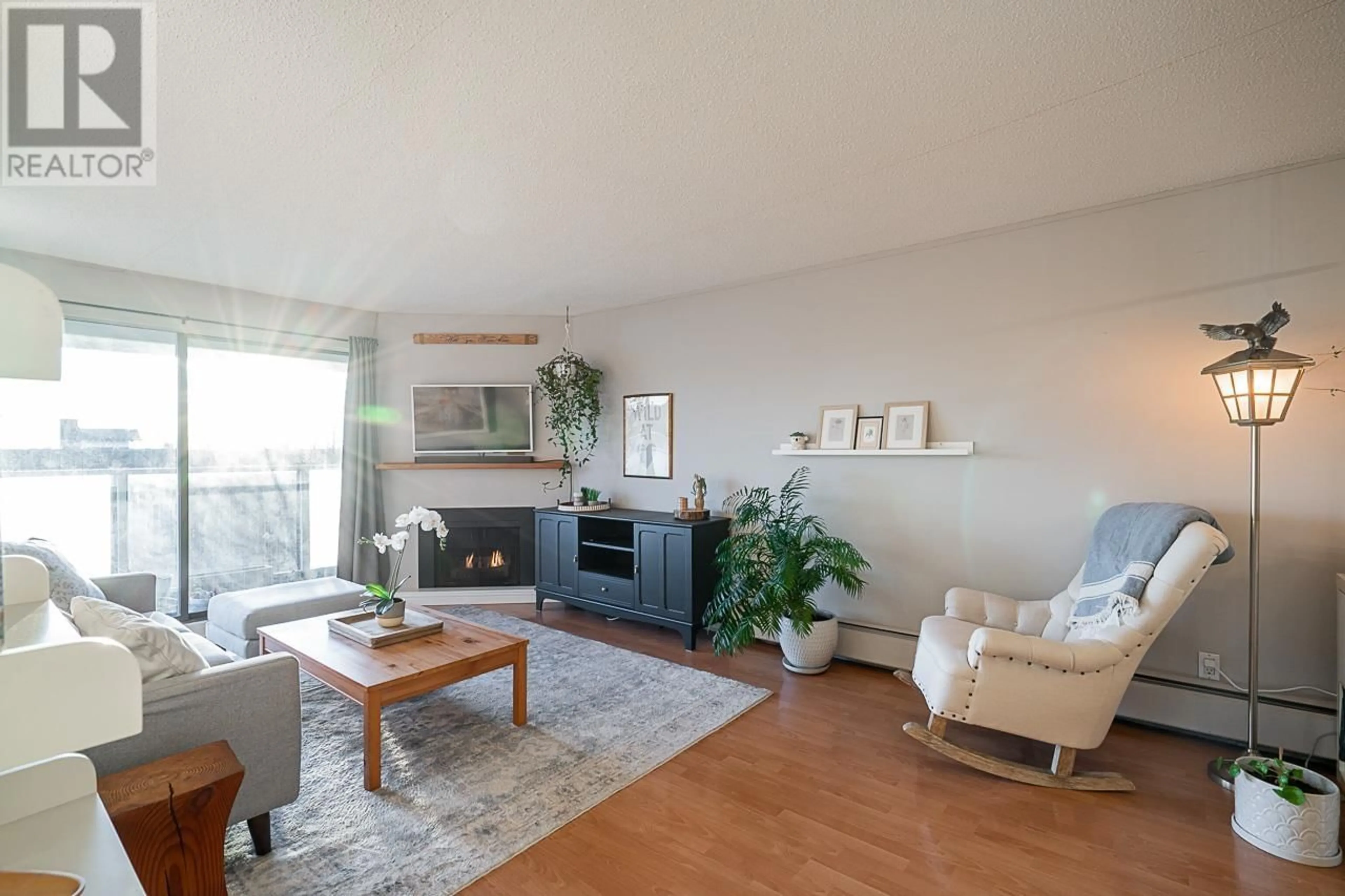 Living room with furniture, wood/laminate floor for 208 308 W 2ND STREET, North Vancouver British Columbia V7M1E1