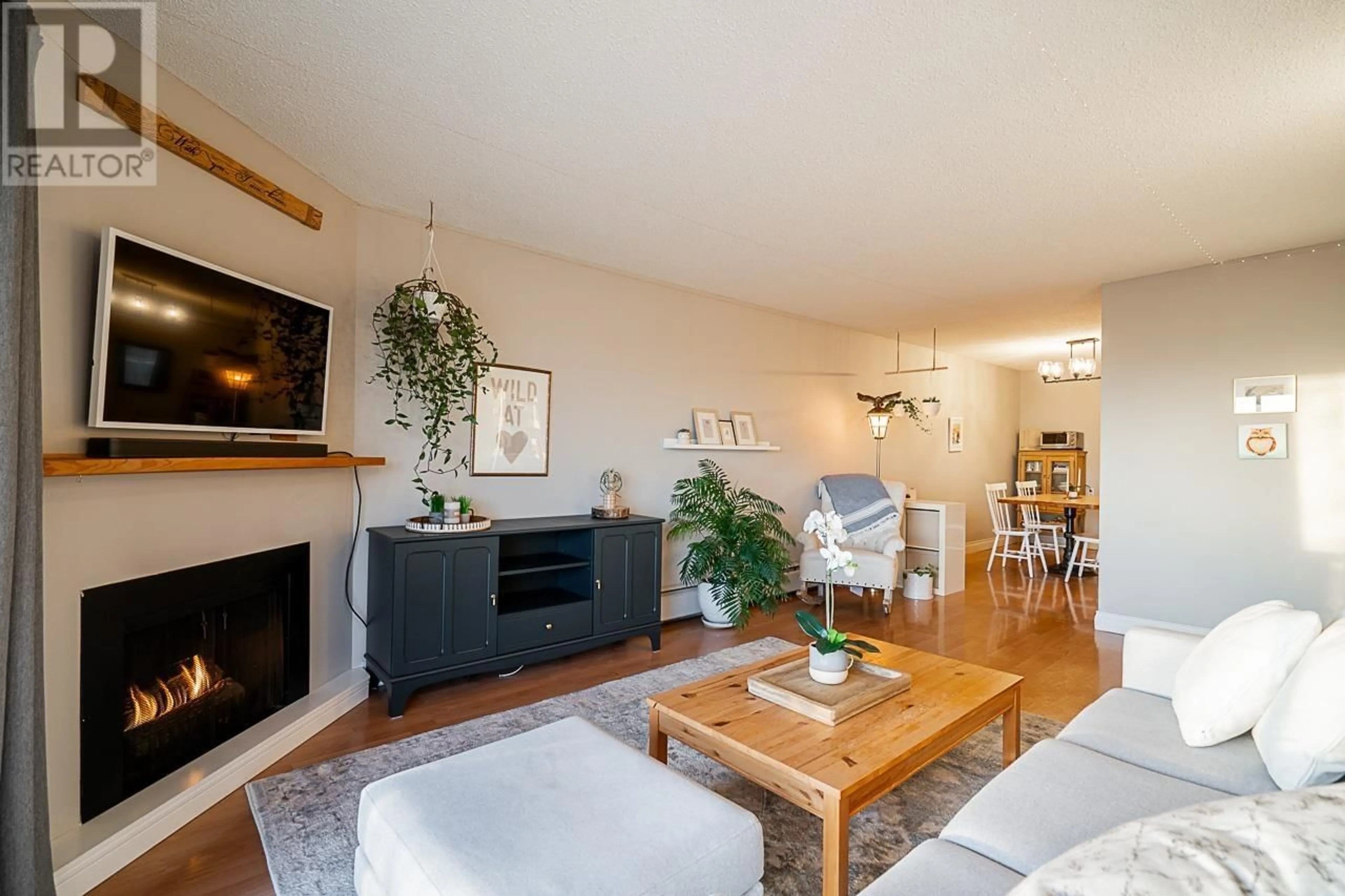 Living room with furniture, wood/laminate floor for 208 308 W 2ND STREET, North Vancouver British Columbia V7M1E1