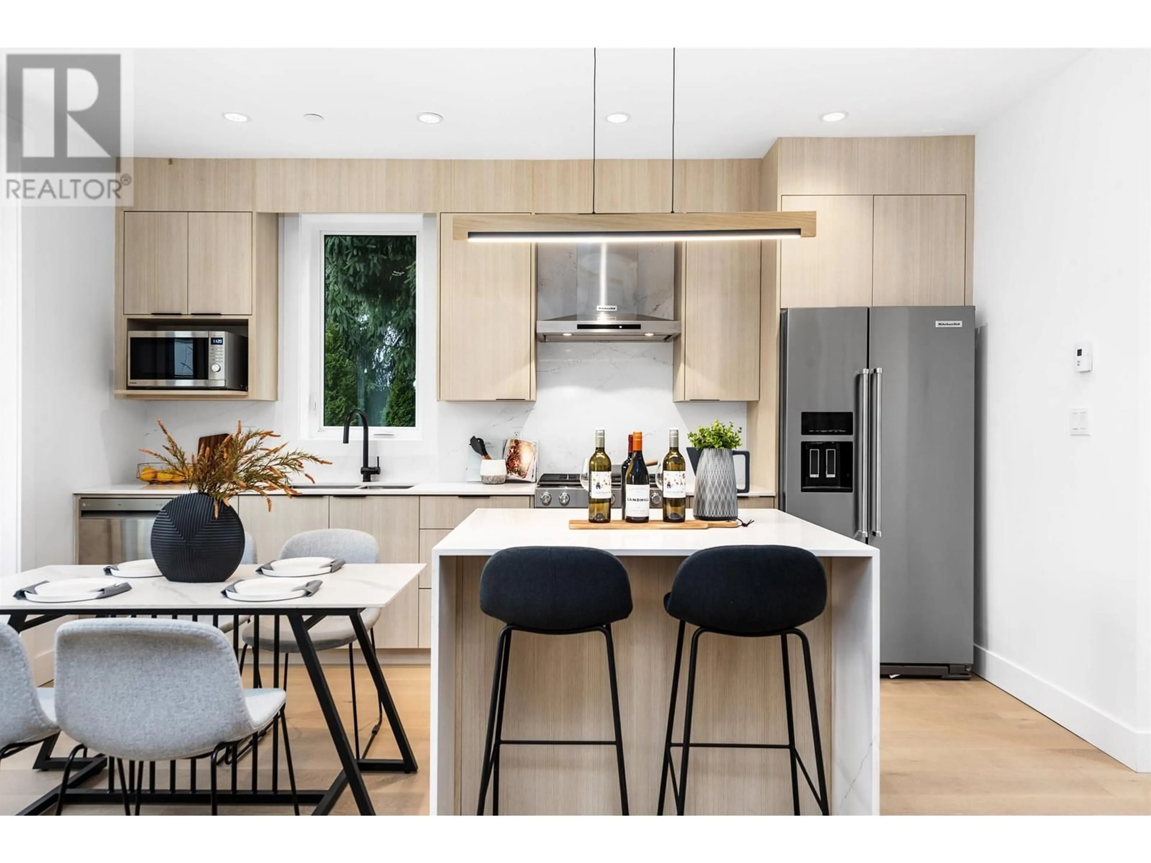 Open concept kitchen, wood/laminate floor for 2038 1ST AVENUE, Vancouver British Columbia V5N1B5