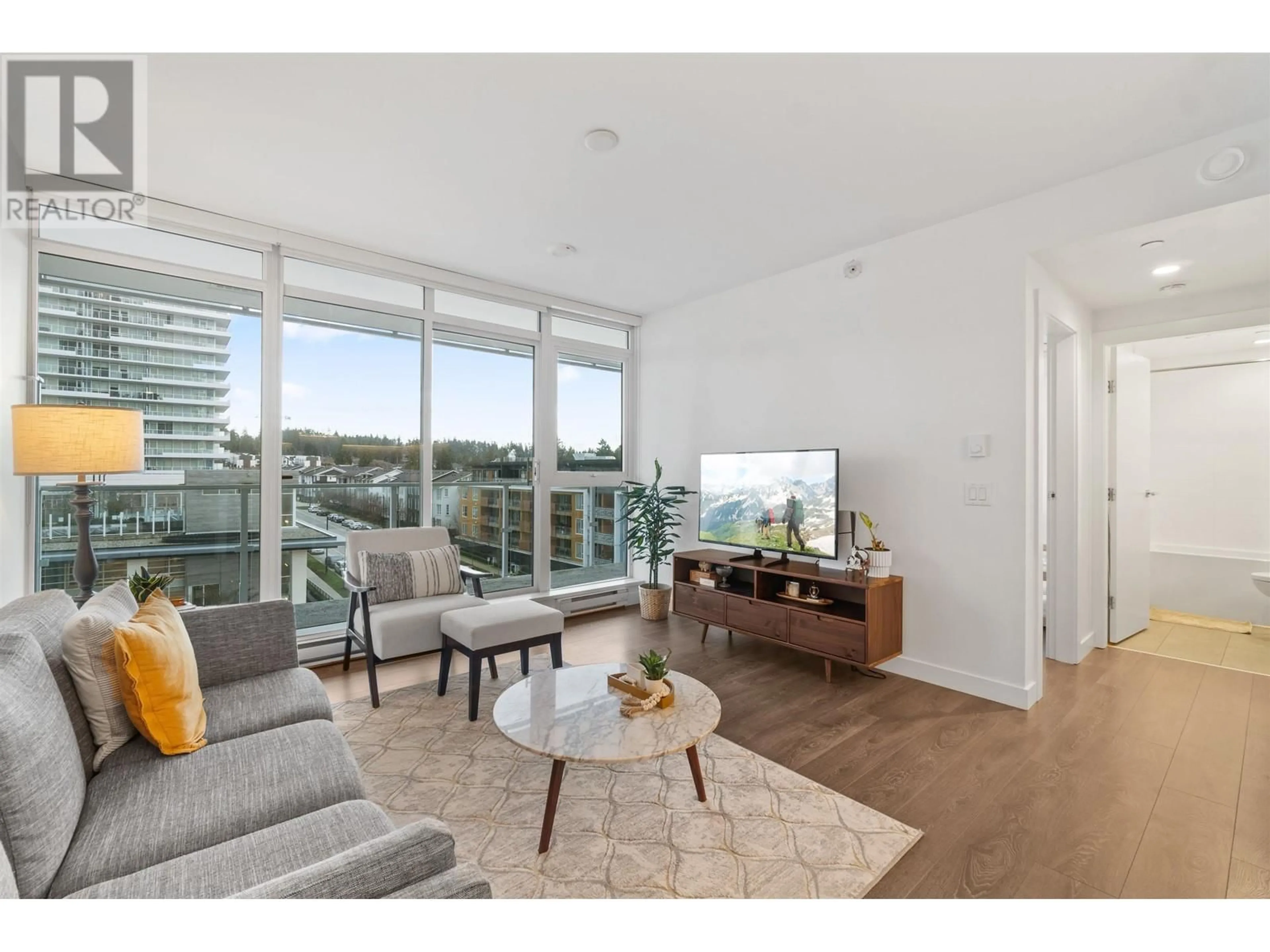 Living room with furniture, wood/laminate floor for 602 652 WHITING WAY, Coquitlam British Columbia V3J0K3