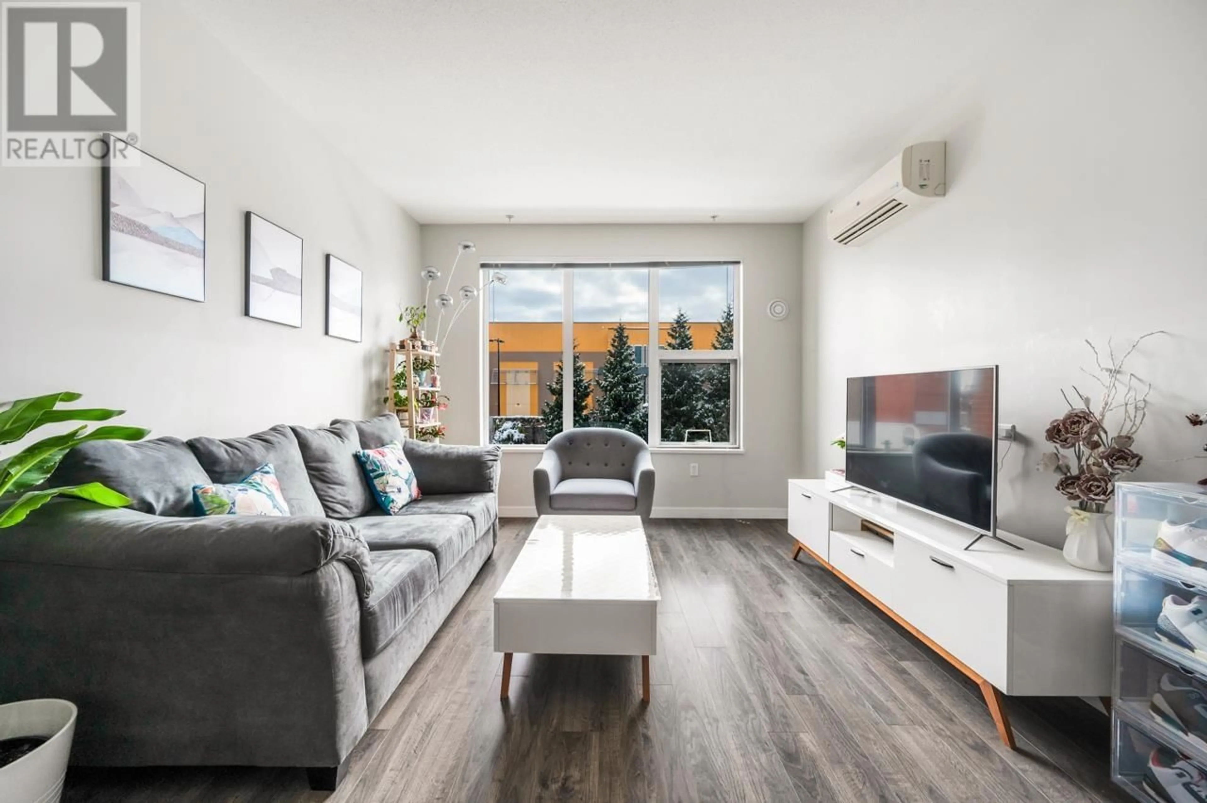 Living room with furniture, wood/laminate floor for 227 9311 ALEXANDRA ROAD, Richmond British Columbia V6X0L8