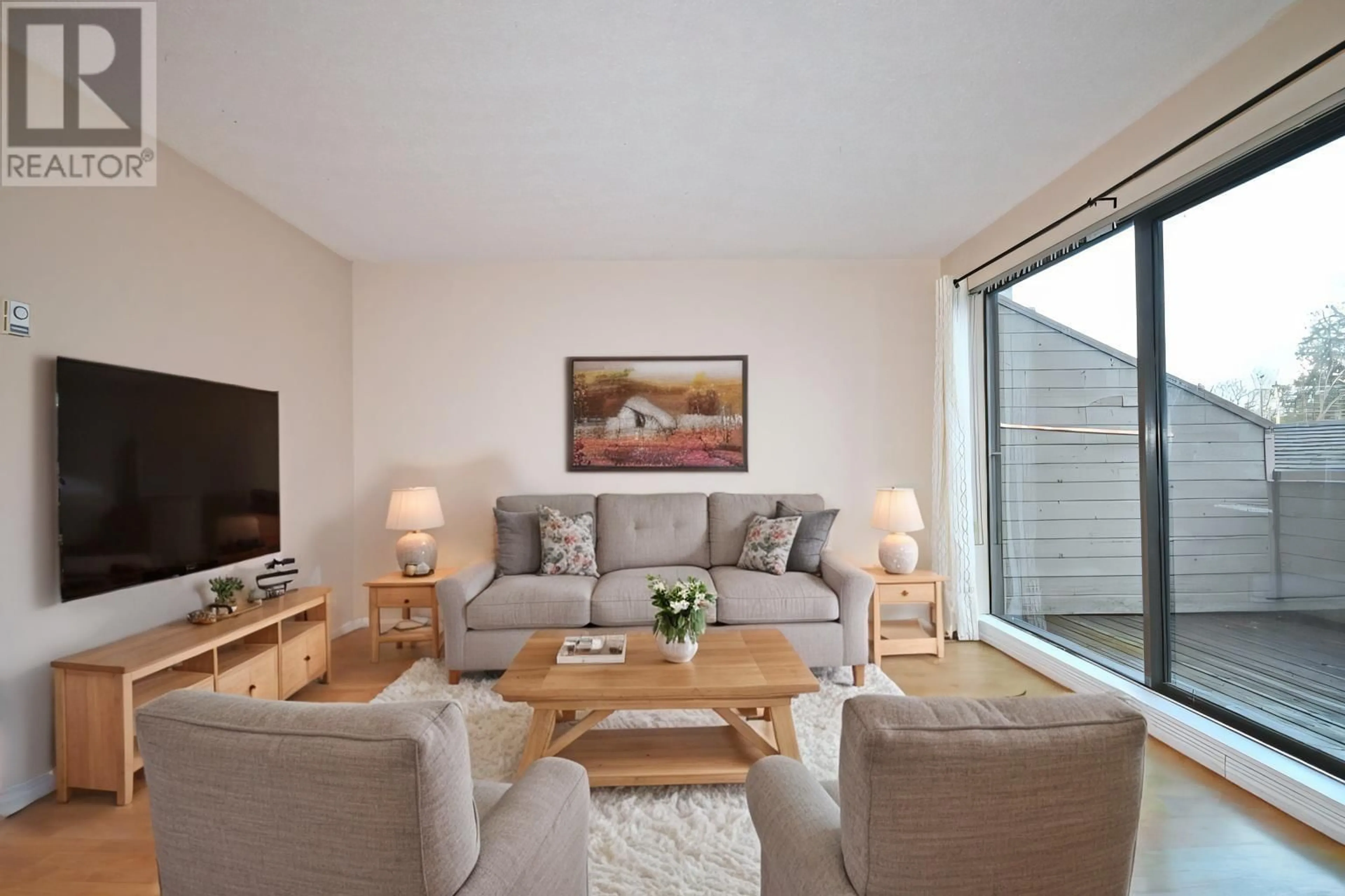 Living room with furniture, wood/laminate floor for 205 - 8160 COLONIAL DRIVE, Richmond British Columbia V7C4T7