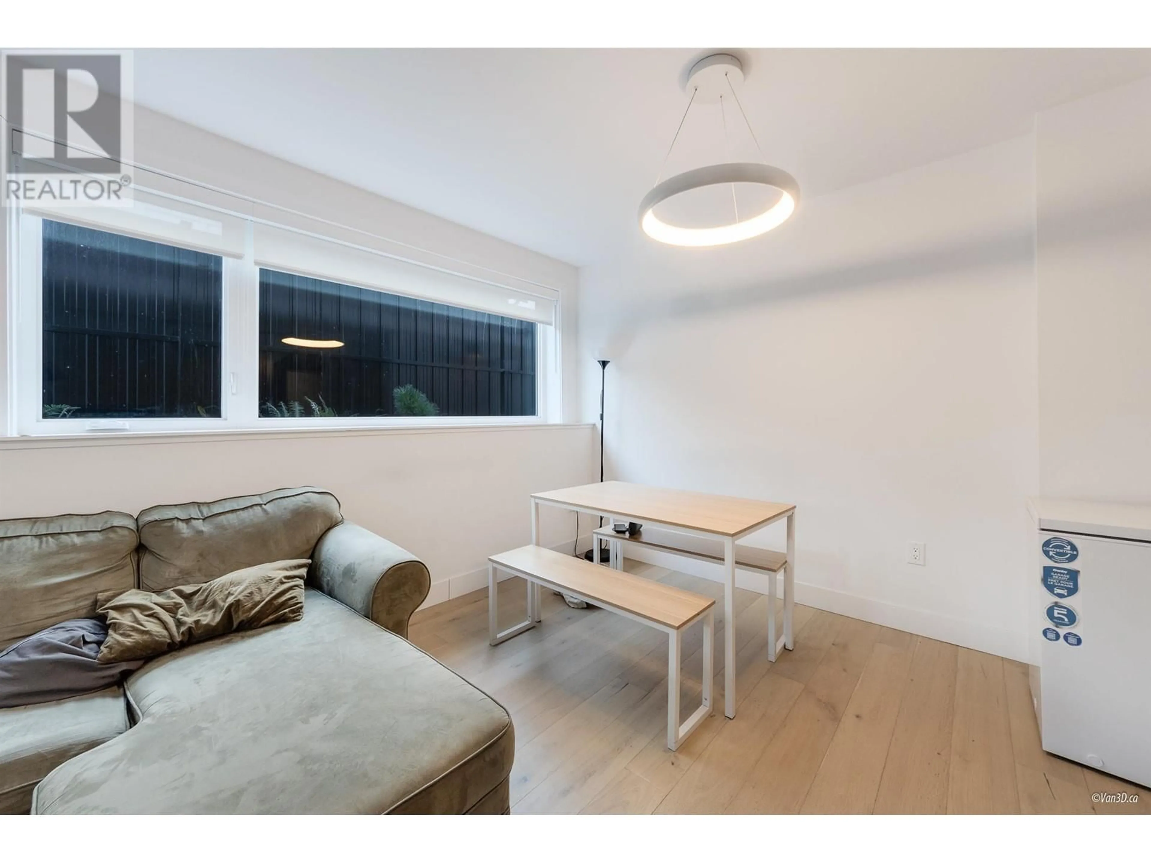 Living room with furniture, wood/laminate floor for 733 E 26TH AVENUE, Vancouver British Columbia V5V2H9