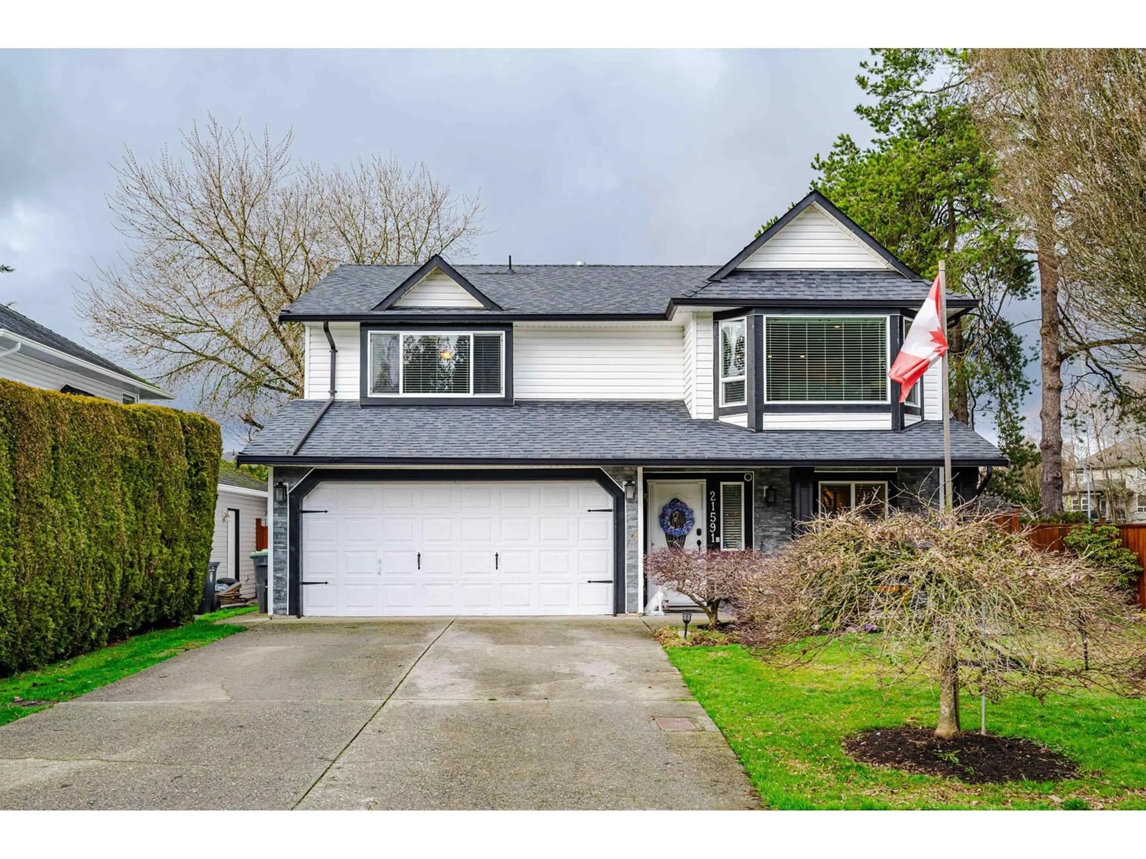 Home with vinyl exterior material, street for 21591 93A AVENUE, Langley British Columbia V1M2H7