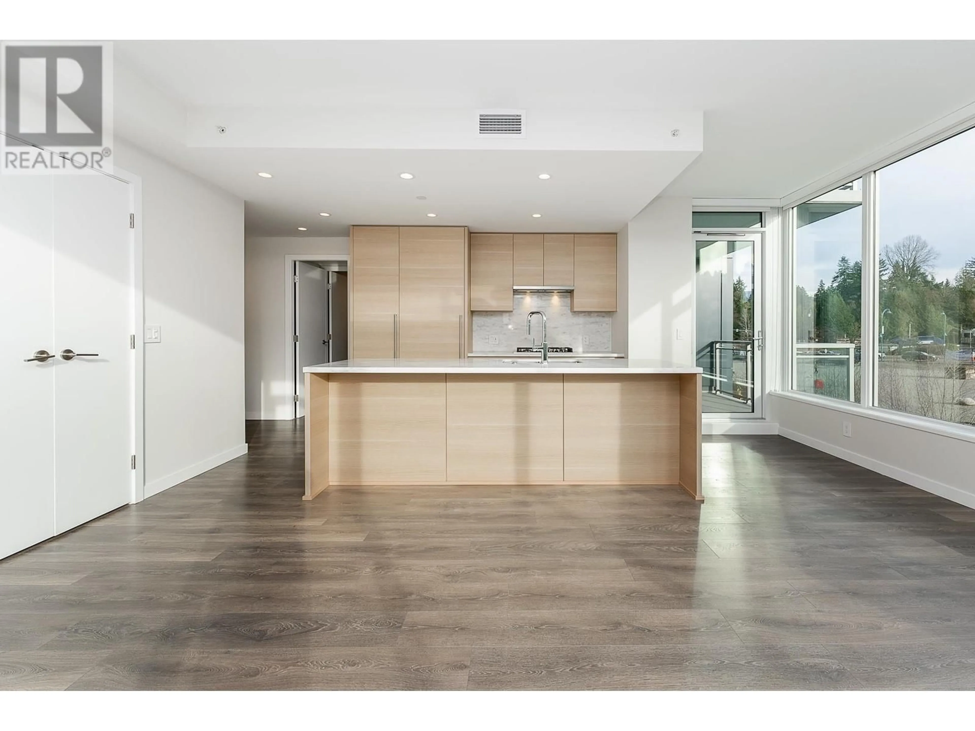 Open concept kitchen, wood/laminate floor for 604 308 MORRISSEY ROAD, Port Moody British Columbia V3H0M2