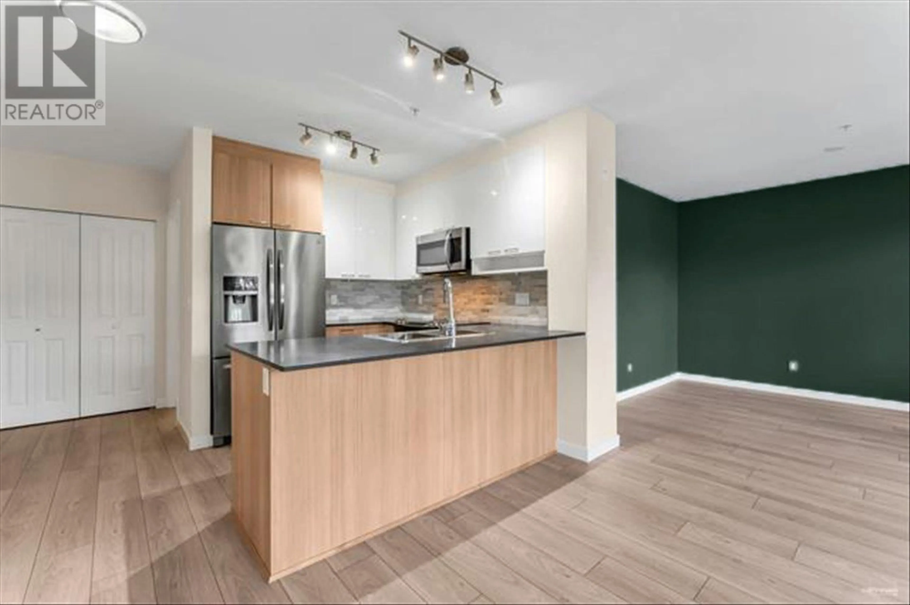 Open concept kitchen, wood/laminate floor for 201 202 LEBLEU STREET, Coquitlam British Columbia V3K4L6