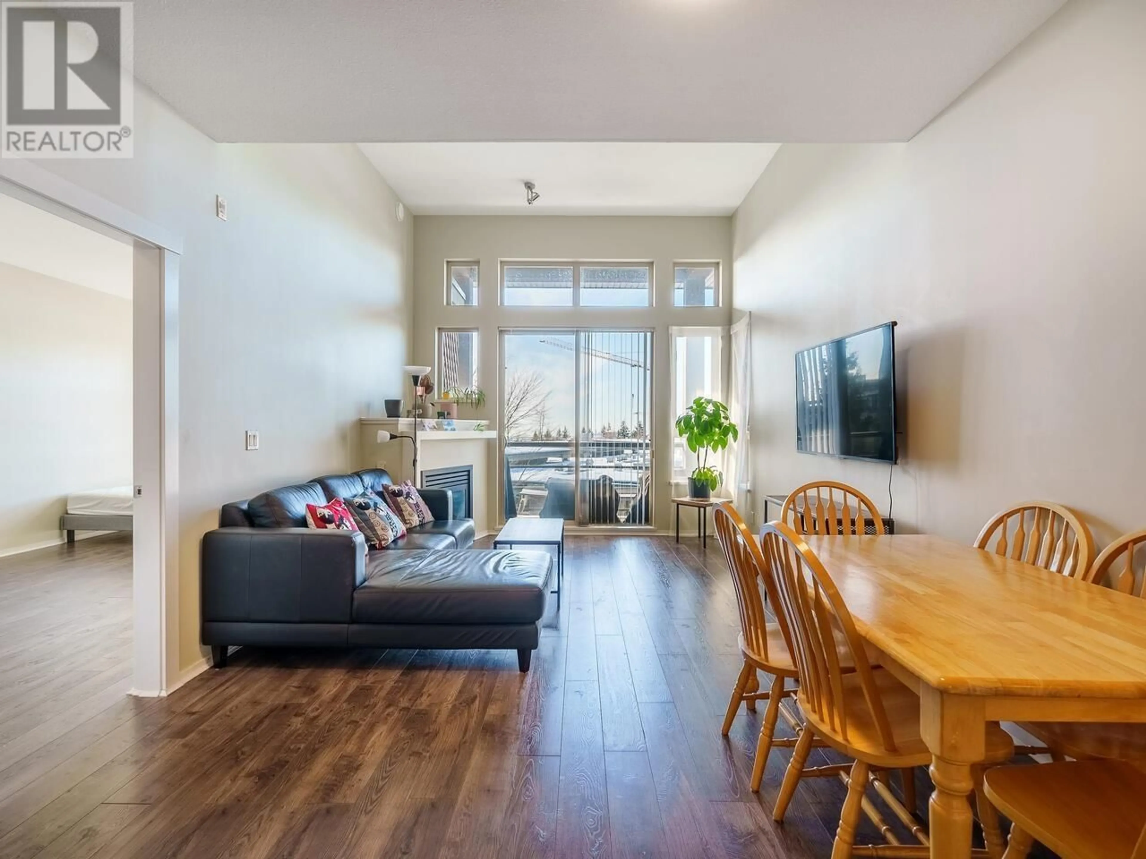 Living room with furniture, wood/laminate floor for 505 - 9319 UNIVERSITY CRESCENT, Burnaby British Columbia V5A4Y5