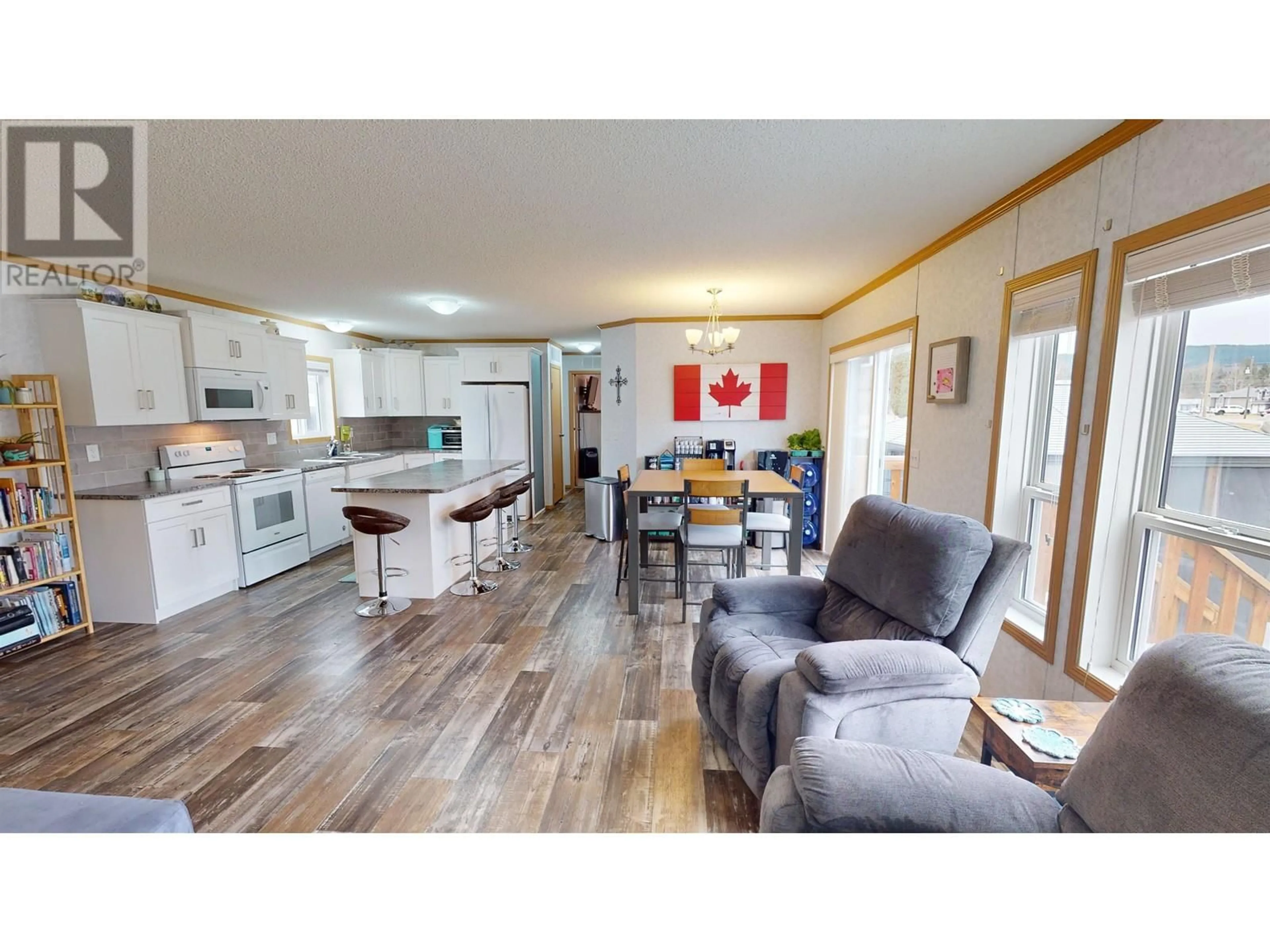 Open concept kitchen, wood/laminate floor for 295 KEROUAC ROAD, Quesnel British Columbia V2J7A2