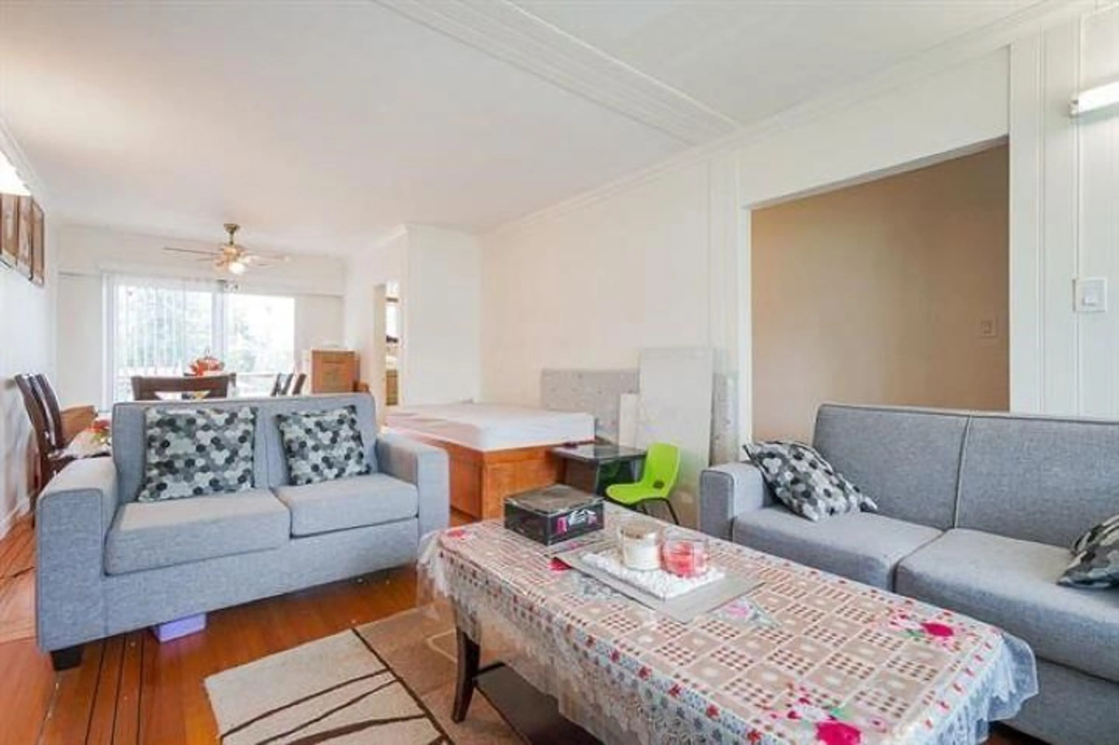 Living room with furniture, wood/laminate floor for 12679 97A, Surrey British Columbia V3V2H6